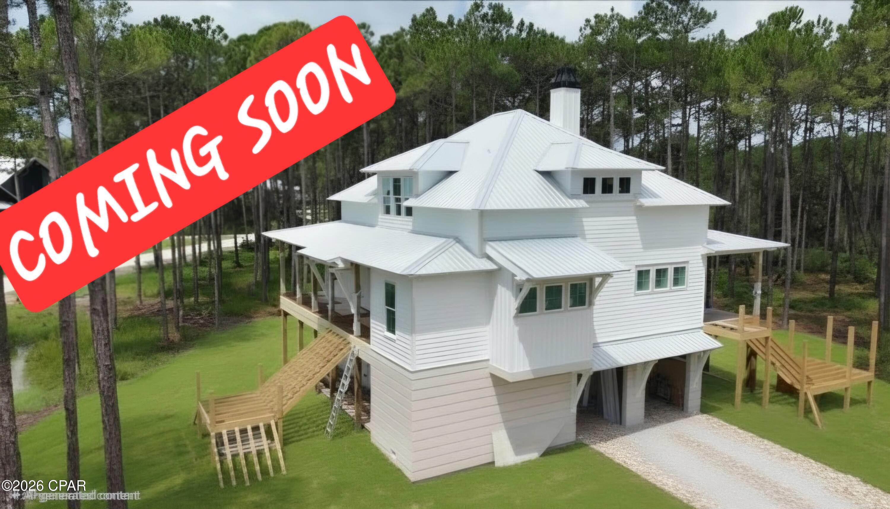 Coming soon- NO SHOWINGS! Experience exceptional coastal living in this stunning 3-bedroom, 3.5-bath elevated residence located in the prestigious RiverCamps on Crooked Creek community in Panama City Beach, Florida. Thoughtfully designed by renowned architect Allison Ramsey, and built by Saltgrass Construction, LLC.  This custom home seamlessly blends timeless Southern architecture with modern luxury and distant waterviews.
From its striking exterior and expansive porches to its elevated design that embraces the natural surroundings of this preserve. Every detail of this home has been carefully crafted to maximize beauty, comfort, and functionality. Inside, you'll discover an open, light-filled floor plan, spacious bedrooms with private baths, private office, flex spaces, abundant storage, and elegant finishes throughout, creating the perfect retreat for both everyday living and entertaining.
Nestled among towering pines and just moments from West Bay, the intercoastal waterway and Crooked Creek, this home offers a unique opportunity to enjoy one of Northwest Florida's most sought-after gated communities. RiverCamps features world-class amenities including a waterfront community room and pool, community docks, boat storage, walking trails, a play ground, pickle ball, and abundant opportunities for boating, fishing, kayaking, and wildlife viewing. The new state of art fitness center is scheduled to be completed in October of 2026.
Whether you're searching for a full-time residence or a luxurious coastal escape, this extraordinary home offers an unmatched lifestyle where nature, architecture, and elegance come together. 
Home will be complete in September of 2026.