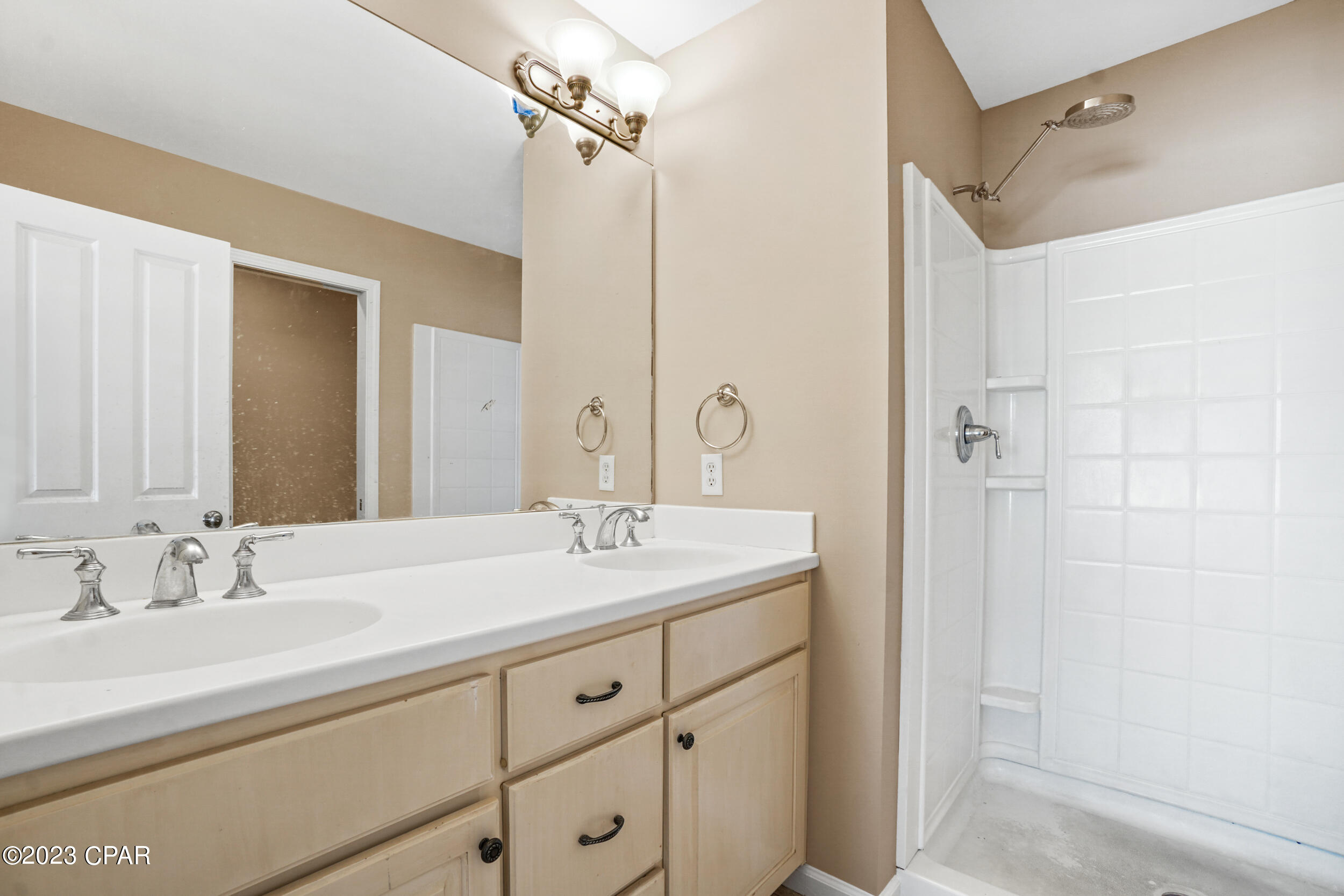 Upgraded townhouse located in Annabella's, a gated community located in Panama City Beach. Recent updates include new paint, new carpet and new water heater. This 2 Bedroom, 2 1/2 bath unit has an upgraded kitchen featuring granite counter-tops, glass tile back-splash , and stainless steel appliances. The laundry room has been remodeled to include barn doors, additional space to accommodate side by side washer and dryer, extra hanging space and storage. In addition is a convenient 1/2 bathroom on the 1st floor. Both bedrooms are located on the second floor and include ensuite bathrooms. The master bedroom has two closets of which one is a remodeled large walk-in with built-in shoe rack.