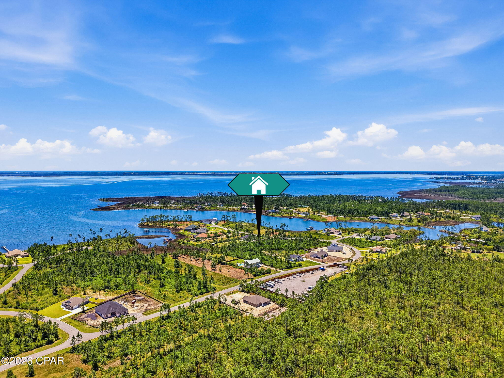 Nestled within the gated coastal community of Laird Bayou, this beautiful vacant lot on almost a full acre offers the perfect canvas to build your dream home. Surrounded by natural beauty and a peaceful, serene atmosphere, this spacious homesite provides both privacy and a true sense of coastal living. 
 Residents enjoy exclusive access to a community boat ramp with Bay and Gulf access, making it ideal for boating, fishing, and water enthusiasts. The neighborhood also features a refreshing community pool and the convenience of private RV and Boat storage.
 Whether you're envisioning a full-time residence or a relaxing coastal retreat, this property combines tranquility, security, and exceptional amenities in one desirable location.