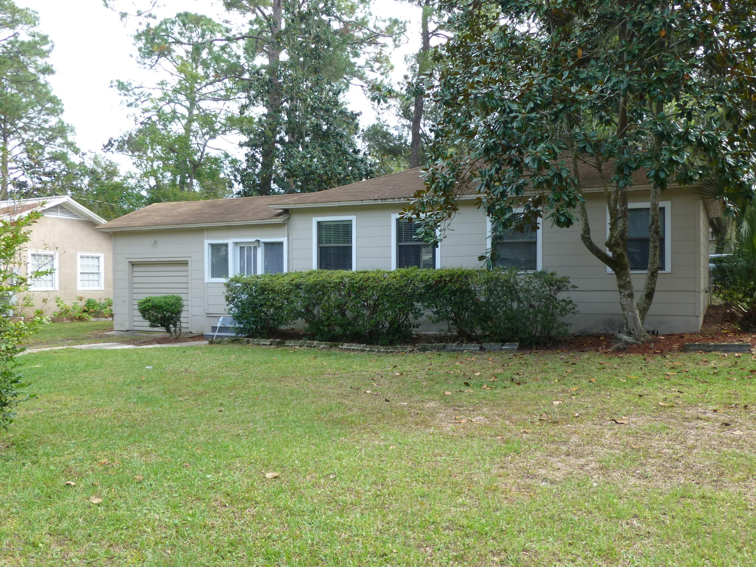 Age.SQ FT, Lot and Room Sizes Approximate. Brand New Roof 2/26/2016 * This little beauty won't last long. New solid wood kitchen cabinets, Travertine back splashes, Quartz countertops and cork flooring in Gourmet kitchen * Hardwood Floors * Living/Ding L and open, airy floor plan * Recently re-plumbed from the meter throughout the home. Updated electrical box * Gas cook-top and gas tankless HWH. Double pane windows *  Fenced in back yard plus a circular drive and RV hookups in the back from alley entrance