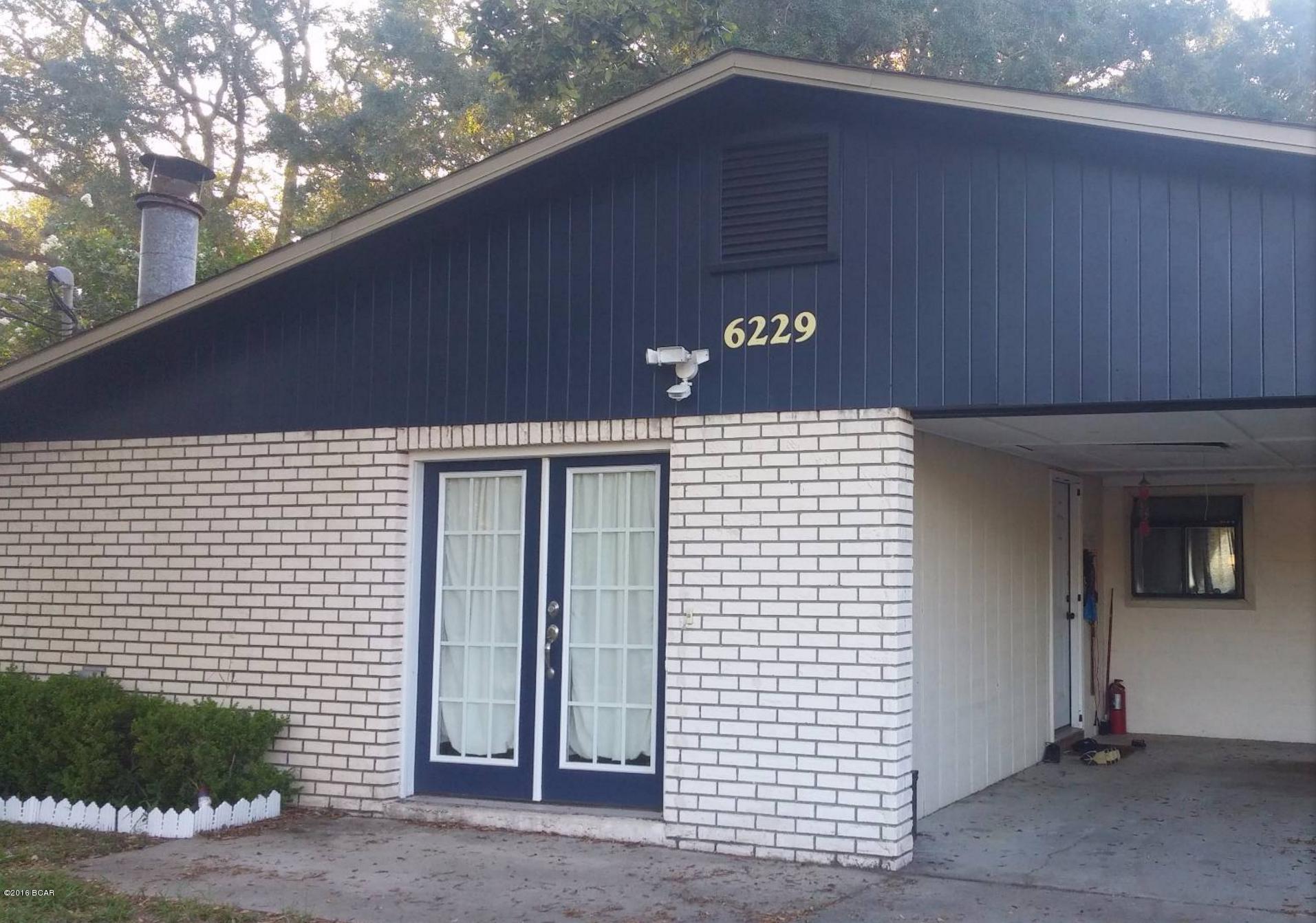 Waterfront home with a family room, fireplace, a living room with a beautiful view of the Bay, a large open kitchen that is perfect for entertaining, a split bedroom floor plan, and fenced backyard.