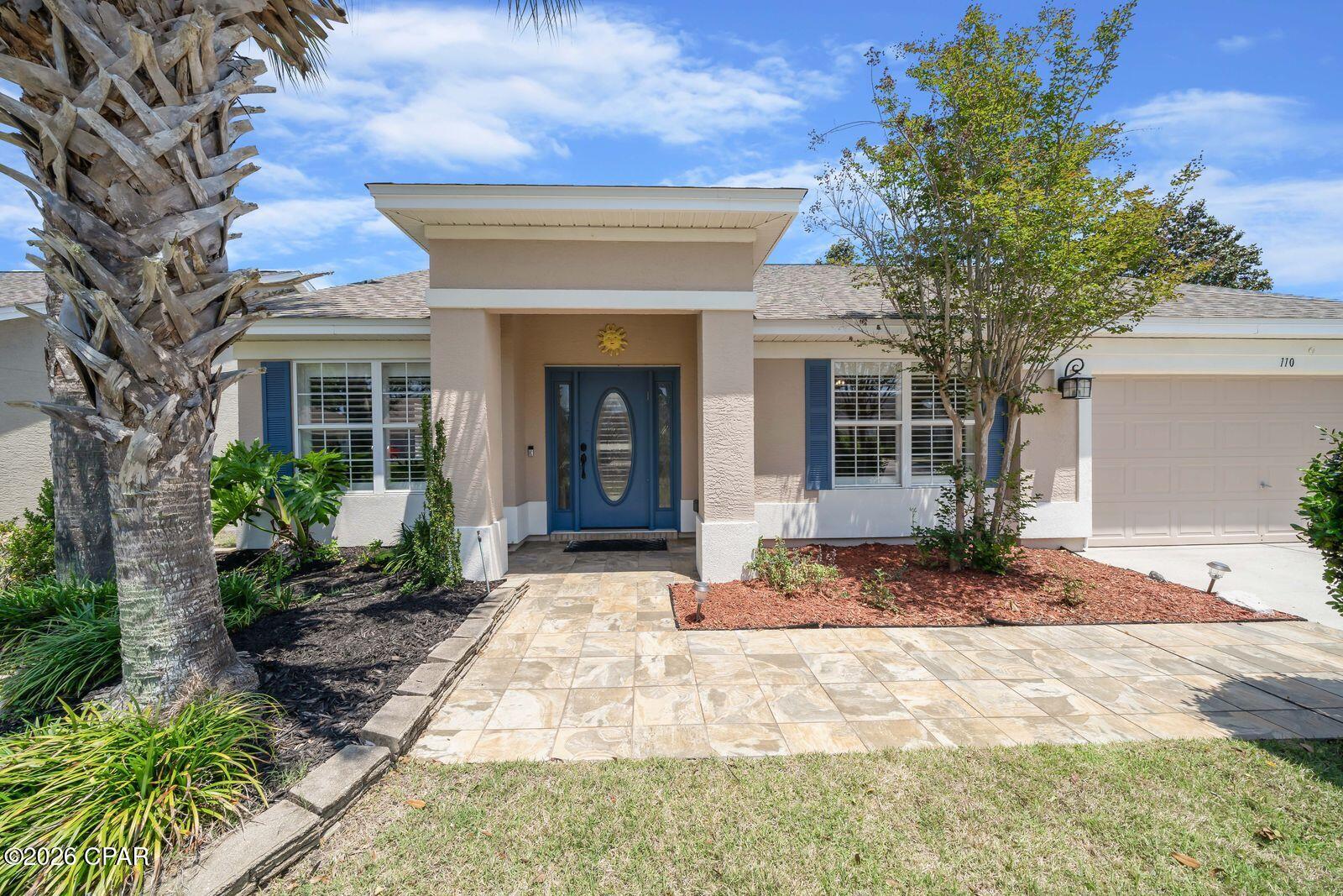 Lowest priced home with a pool in Palmetto Trace.  This beautifully updated 4-bedroom, 2.5 bath home with a private screened-in pool is move in ready!  This is one of the most desirable homesites in the community. Backing to a serene nature preserve, this property offers exceptional privacy with no rear neighbors. This move-in-ready home showcases fresh interior and exterior paint, a roof less than 4 years old, luxury plank flooring, newer HVAC, and new pool equipment. The updated kitchen features brand-new cabinetry, while the renovated primary bath offers a stunning walk-in shower. A split-bedroom floor plan provides added privacy, and two separate living areas create flexible space for both relaxing and entertaining. Additional highlights include plantation shutters, a covered porch, and a spacious backyard. Residents of Palmetto Trace enjoy access to two community pools and a prime location just minutes from the  beaches of Panama City Beach, an easy golf cart ride away. You're also close to Pier Park, Topgolf Panama City Beach, and Frank Brown Park, along with top shopping, dining, and entertainment options. A fantastic opportunity to own an updated home with highly desirable location in one of Panama City Beach's most sought-after communities. Truly move-in ready, call us for your showing today!