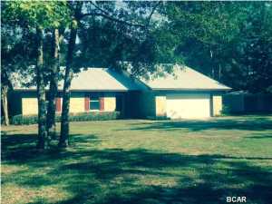 This great brick home sits in the middle of 2 acres is like new with a new metal roof, new carpets, new garage door and freshly painted. The HVAC was replaced in 2008. Includes a wood burning fireplace and bright open kitchen with lots of counter space. It features a 20x22 workshop with 10' lean to on both sides and electric. Separate 12X20 shed with electric, AC, cable, sheet rock, carpet & 20x24 double carport. An 8x10 pump house and yes, another 12x20 storage shed. It is close enough to the mall (15 minutes) but yet in the country located in a quiet area of Deerpoint. Make an appointment to see soon.