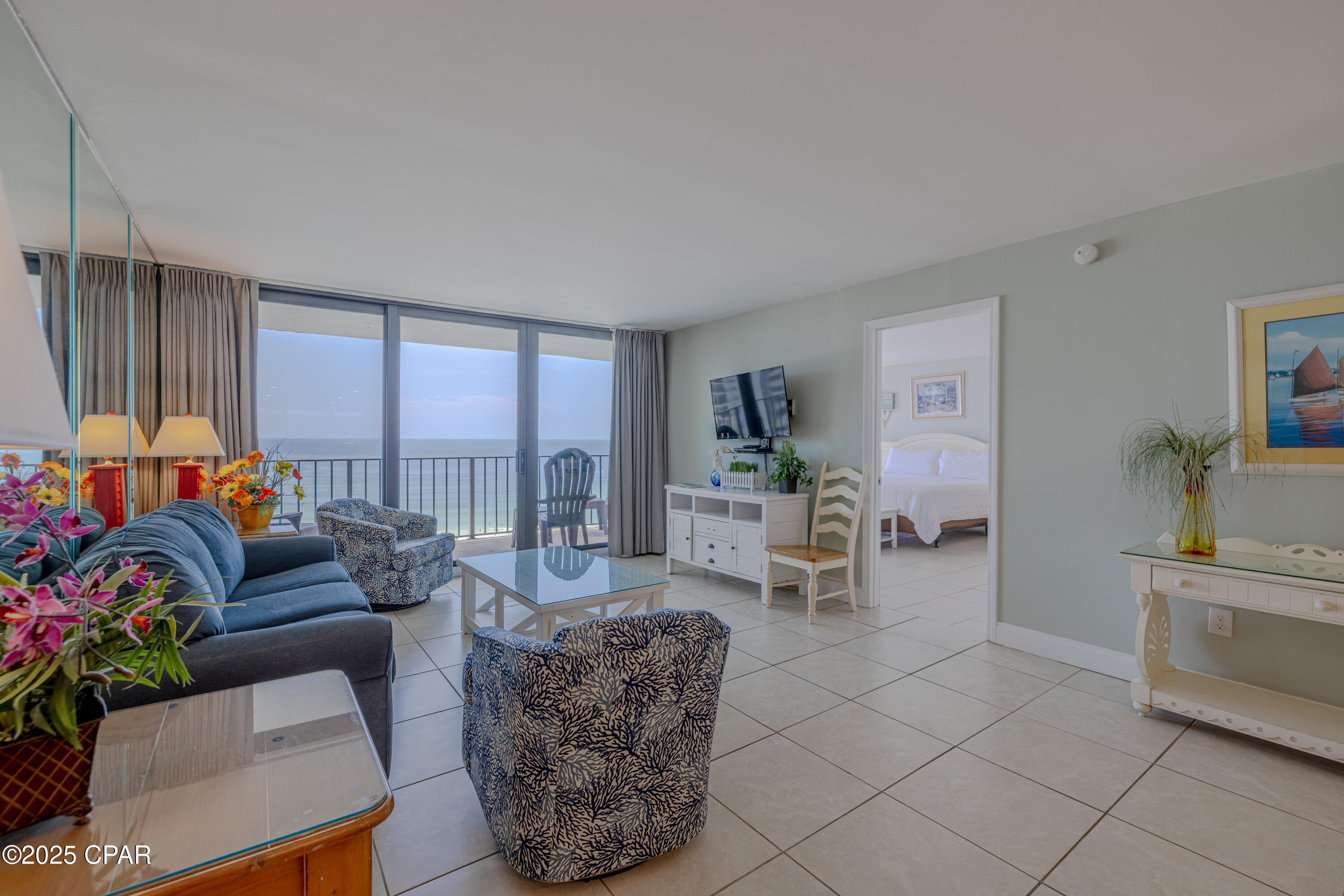 Welcome to Edgewater Beach & Golf Resort Tower I #1010, a desirable 10th-floor Gulf-front condominium offering breathtaking views of the sugar-white sands and turquoise waters of the Gulf of America. This spacious 2-bedroom, 2-bath condo features 1,317 square feet and comfortably accommodates up to 10 guests, making it an ideal rental investment, second home, or full-time residence.

Inside, you'll find tile flooring throughout for easy maintenance and a thoughtfully designed open-concept living space. The fully equipped kitchen features updated cabinetry, granite countertops, stainless steel appliances, a breakfast bar, dining area, and stackable washer and dryer. The living room offers a sleeper sofa for additional accommodations and opens directly to the private balcony, where stunning Gulf views create the perfect setting for relaxing with a morning cup of coffee or tropical cocktail.

The Gulf-front primary suite is a true highlight, featuring floor-to-ceiling glass windows, direct balcony access, a king-size bed, and a private ensuite bath with a glass-enclosed walk-in shower, and walk-in closet. The guest bedroom is furnished with two twin-over-full bunk beds and has access to a full bath featuring a tub/shower combination.

The private balcony overlooks Edgewater's spectacular lagoon pool, children's splash pad, and lush tropical landscaping, providing a front-row seat to local wildlife and unforgettable sunsets over the Gulf.

Edgewater Beach & Golf Resort is one of Panama City Beach's premier destinations, offering exceptional amenities including a 9-hole golf course with pro shop, beachfront restaurant, poolside bar, fitness center, tennis, pickleball, basketball and shuffleboard courts, multiple pools and hot tubs, arcade, convenience market, electric vehicle charging stations, and beautifully landscaped grounds.

Situated in the heart of Panama City Beach, you'll enjoy convenient access to Pier Park, popular dining and entertainment venues, and the Shoppes at Edgewater just a short walk away.