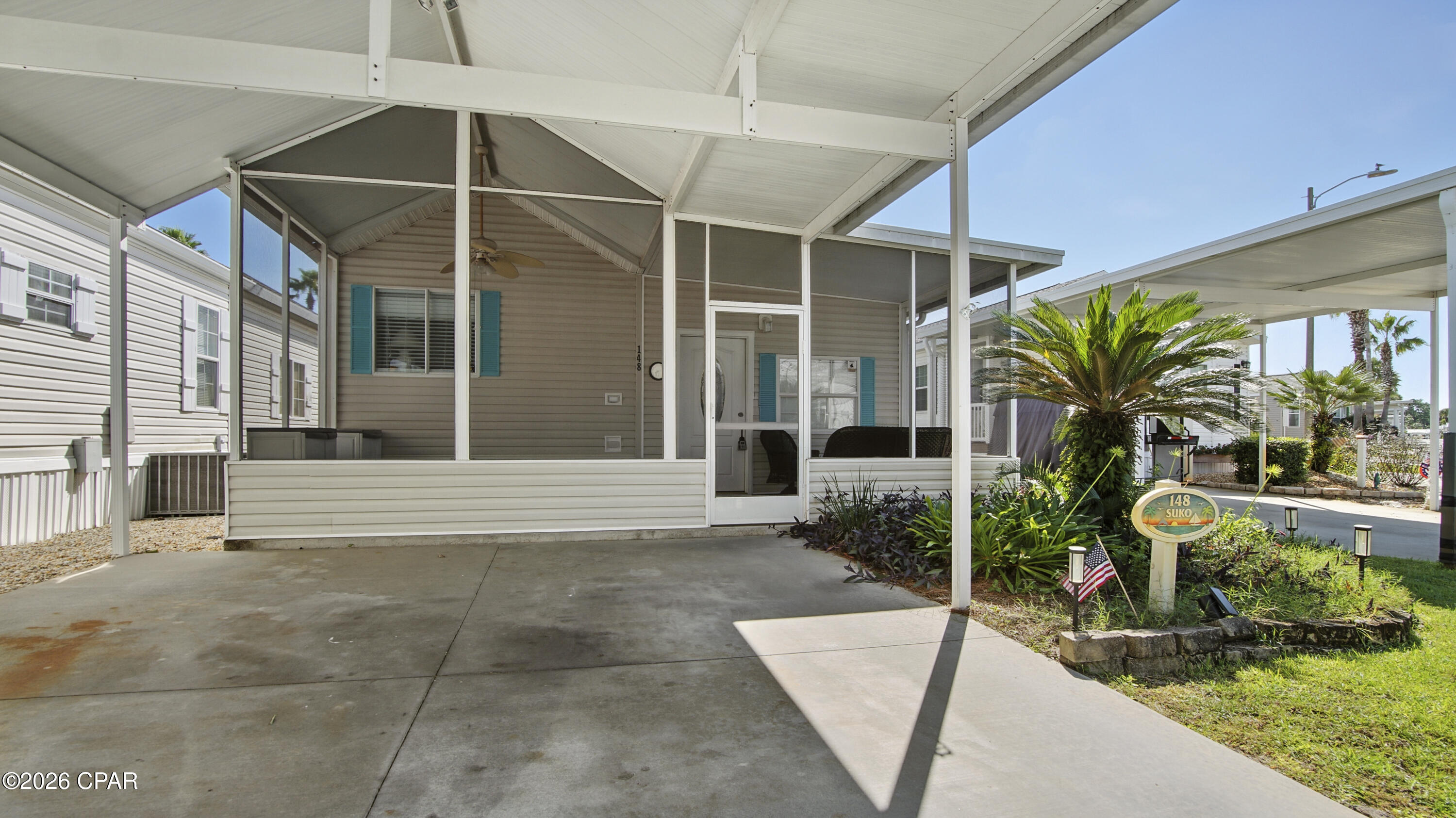 Welcome to Cottage 148 in Emerald Pointe Resort--a delightful coastal retreat with a carport and the PERFECT porch for enjoying the Florida lifestyle. This cottage features a large primary bedroom, spacious family room, and comfortable flow designed for easy full-time living or extended beach escape getaways. Offered partially furnished and ready for your personal decorator touches, this cottage in this unique community is an outstanding opportunity for full-time living, a second home, or an income-producing short-term rental.
Emerald Pointe Resort is one of Panama City Beach's hidden gems--a gated, pet-friendly, golf-cart-friendly community in the highly desirable Upper Grand Lagoon area. Unlike crowded high-rise condos, this low-density neighborhood offers you the opportunity to own a detached, single-family cottage with covered, private parking  in a secure, gated community with resort-style amenities.
Residents and guests enjoy access to two swimming pools (one seasonally heated), a hot tub, large clubhouse with full kitchen, Ping-Pong table, fitness center, catch and release fishing pond, shuffleboard, and beautifully maintained grounds. The peaceful setting offers the perfect balance of privacy, convenience, and recreation.
With its ideal Upper Grand Lagoon location, you're just minutes from the sugar-white beaches of the Gulf, several marinas on Grand Lagoon, shopping, dining, and local attractions. St. Andrews State Park, Shell Island, and Pier Park are all within easy reach, while Northwest Florida Beaches International Airport is just a 30 minute drive away.
Whether you're searching for a primary residence, vacation getaway, or smart investment property, Cottage 148 delivers the best of beach living in one of the area's most charming, gated communities.