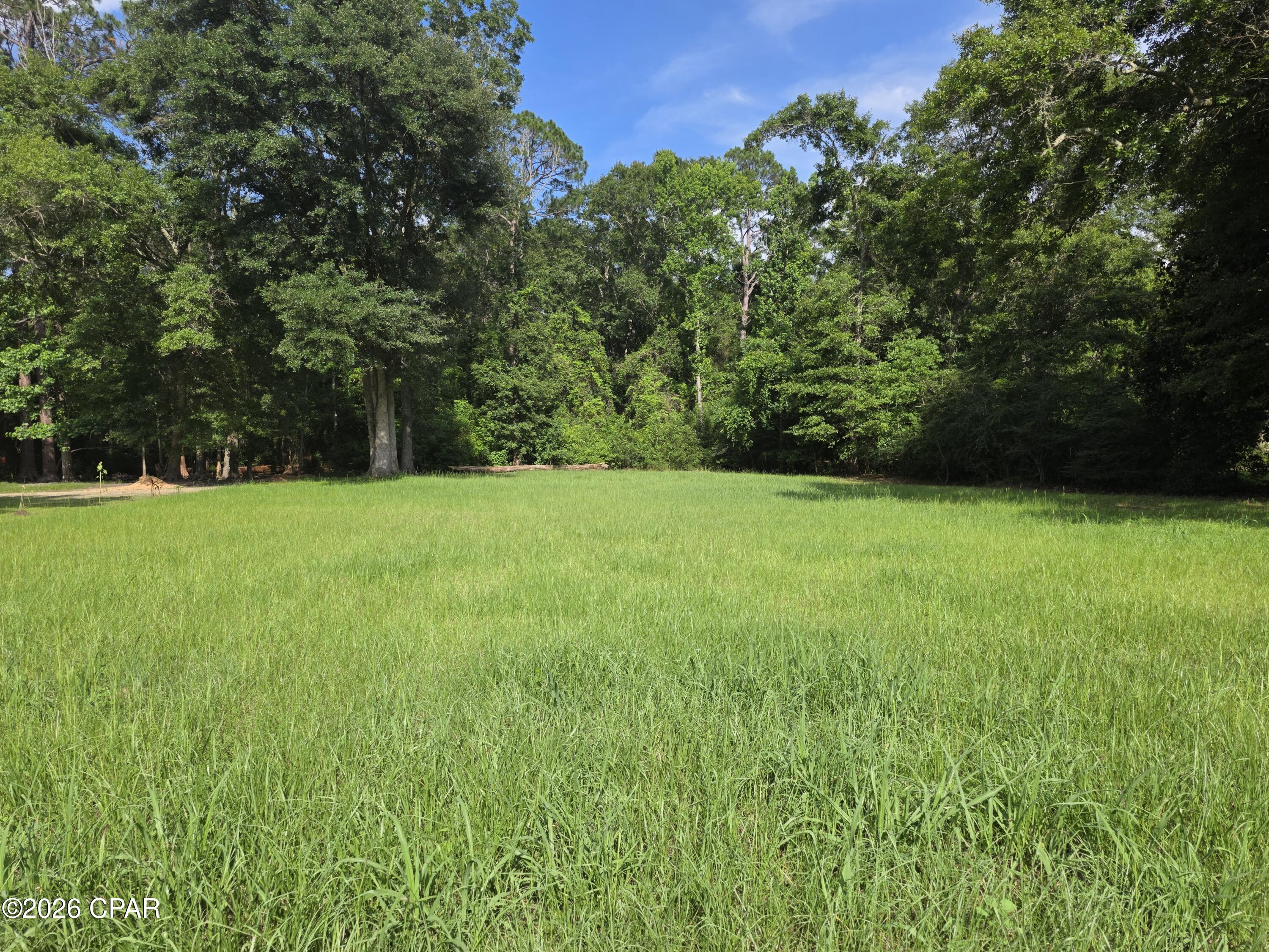 Nice wooded lot in the city limits of Chipley.  This 3.88+/- acre parcel has approximately a half acre cleared homesite and the remaining is wooded. Great location for your new home or a possible division for an additional home with a zoning change. Close to all the amenities of small town living and I-10. Approx. 45 minutes to Panama City Beaches.