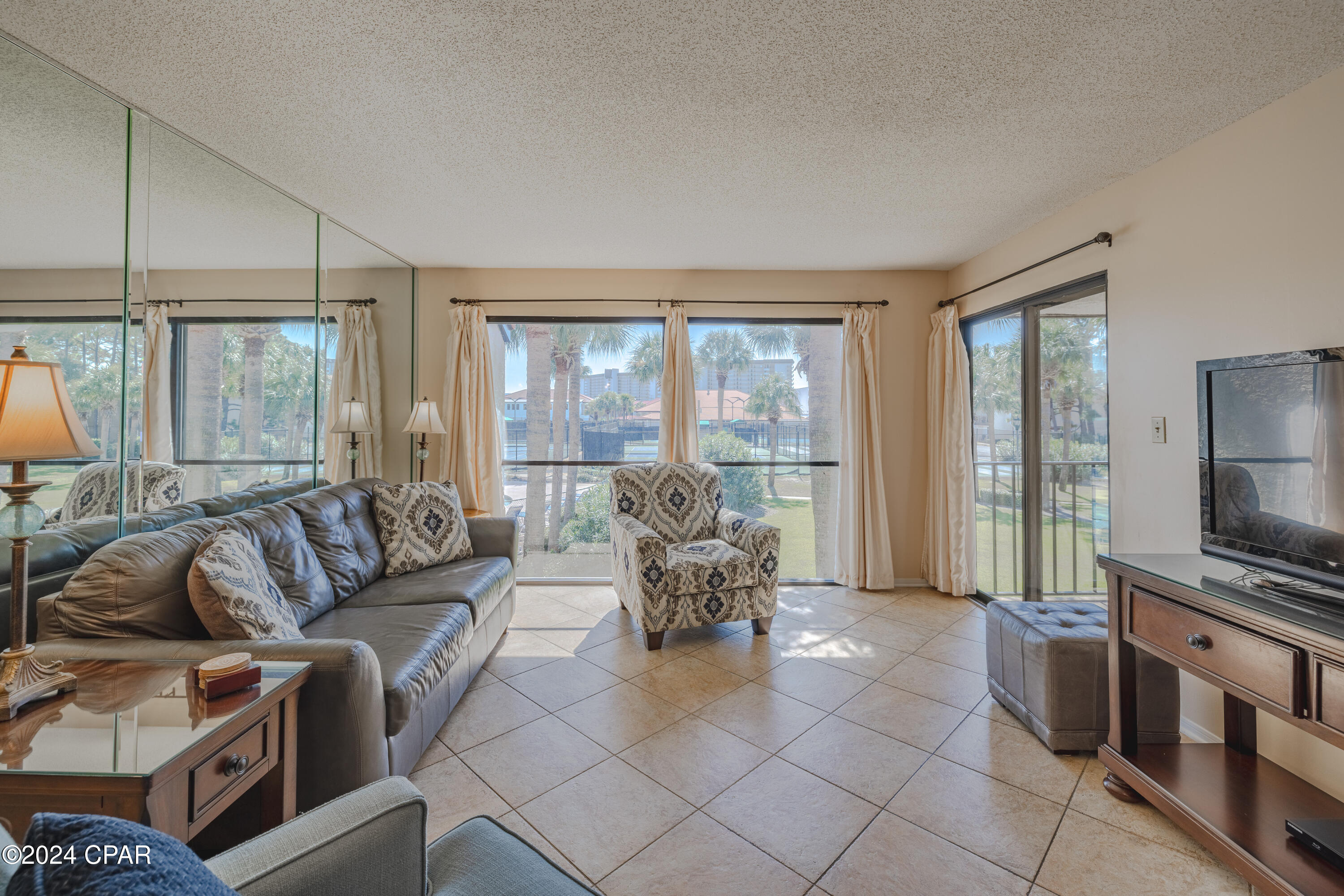 Discover one of Panama City Beach's most desirable gated Beach resorts—this exceptional 2nd-floor Tennis Villa in the exclusive Edgewater Resort. Nestled in a vibrant beach, tennis, and golf community, this villa offers a seamless open-concept living, dining, and kitchen area perfect for both relaxation and entertaining. The split-bedroom floor plan enhances privacy, while the master bedroom and main living area open to a generous balcony with serene pool views. Edgewater Resort is a premium, full-service destination along the iconic white sands of the Gulf of Mexico, featuring unparalleled amenities. Enjoy an impressive 11,800 sq. ft. lagoon pool with cascading waterfalls, nine heated pools (seasonal), four hot tubs, and seasonal poolside activities with live music. The resort's dining options include Ocean's, a full-service restaurant and bar, a Starbucks café and ice cream parlor, and a casual pizza shack. Additional perks include a spa, fitness center, 9-hole executive golf course, and 11 lighted tennis and basketball courts. This villa is an ideal choice for those seeking a wonderful, relaxed beach lifestyle, offering everything needed for a perfect coastal getaway.