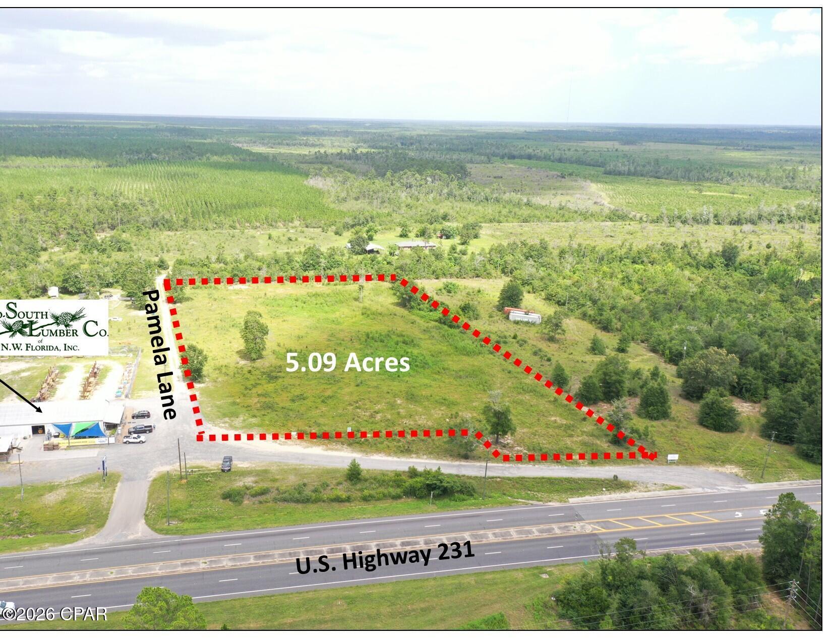 5.09 Acres on U.S Highway 231 in Youngstown, Florida. Located adjacent to Mid-South Lumber. High elevation and a median-cut aligned with the property. Zoned C-1, Commercial in unincorporated Bay County. High & dry with tremendous visibility. Ideal for many commercial uses. Survey attached with the property identified as 'Parcel 2'.