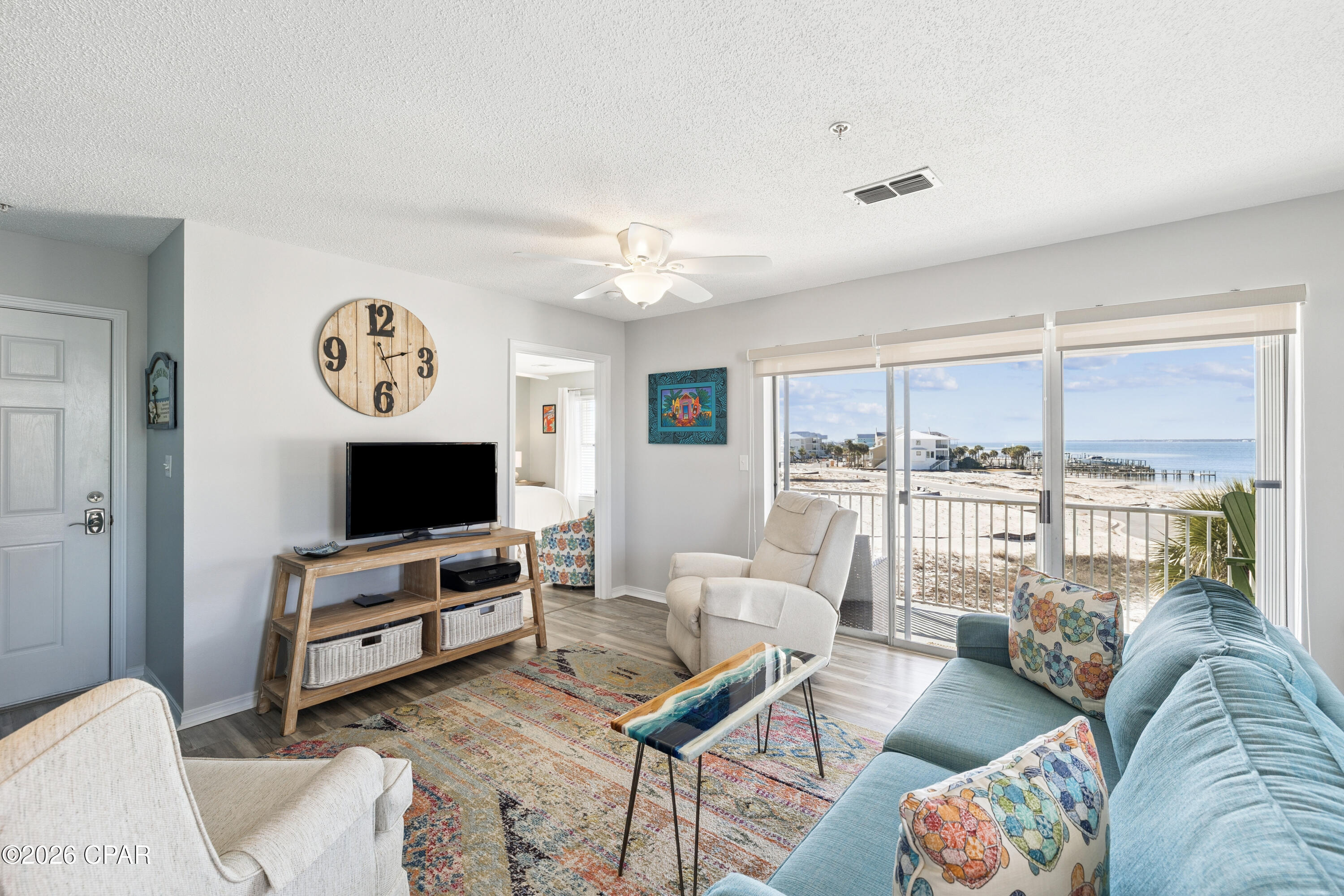 Welcome to 7464 Sunset Harbor Drive, Unit 133, a rare top-floor opportunity in Navarre where the views and serene living the area is known for meet Gulf coast lifestyle flexibility.

This 3-bedroom, 2-bath, 1,028-square-foot condo offers unobstructed views of the Santa Rosa Sound from the living room, kitchen, dining area, and primary bedroom--an exceptional feature that sets this unit apart. Step onto the private balcony to enjoy western sunset views over the water, along with peek-a-boo views of the Gulf, adding a coastal dimension few units here can claim.

The open-concept layout maximizes natural light and water views, creating a comfortable and inviting space for both daily living and entertaining. The kitchen opens seamlessly to the living and dining areas, and the unit is sold furnished, making it truly turnkey. An in-unit washer and dryer adds everyday convenience.

Located in one of Navarre's most sought-after areas, this property benefits from no through traffic, contributing to the peace and quiet Navarre is known for -- yet it remains just moments from the beach, public beach access, restaurants, conveniences, and the Navarre Beach bridge. Community amenities include a pool and grill area, perfect for relaxed coastal living.

Short-term rentals are allowed, with rental income projections as high as $60,000-$75,000 annually, making this an attractive option for investors or second-home buyers seeking rental flexibility.

Whether you're looking for a strong income-producing property, a low-stress vacation home, or both, this is a rare opportunity to own the only available unit in the building with sound views and Gulf glimpses -- in a location prized for its tranquility, accessibility, and coastal charm.

Measurements are approximate. All information is believed to be accurate but should be verified by the buyer if important. Reach out to schedule your private showing today.