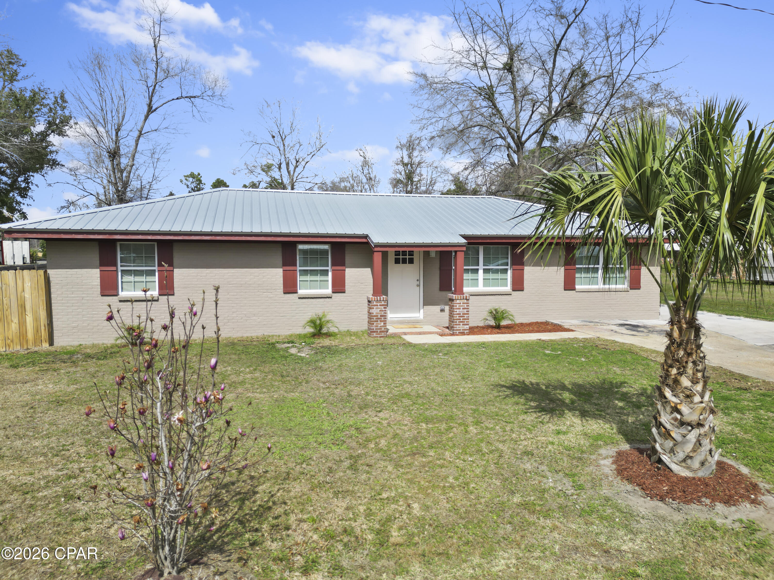 Welcome to this super-cute new construction home nestled within the city limits of Blountstown, FL offering comfort, efficiency, and convenience. Situated on a generous 0.39-acre lot, this thoughtfully designed home features 4 bedrooms and 1 bathroom with a spacious, fully fenced backyard, perfect for pets, play, or outdoor entertaining.The home boasts a durable brick and Hardie board exterior, a sleek metal roof for timeless curb appeal, open cell spray foam insulation offering low-maintenance living, along with a deck located just off the sliding glass door, making it the perfect spot for grilling, relaxing, or enjoying the outdoors. 

Inside, you'll find highly efficient finishes, including soft-close, solid wood cabinetry, granite countertops, tiled shower/tub combo, durable LVP flooring and tile throughout, 10 year transferrable warranty on the HVAC, designed for long-term peace of mind. Every detail reflects modern living with an emphasis on practicality and style. 

Conveniently located near doctors' offices, Calhoun Liberty Hospital, schools, and shopping, this home offers everyday ease without sacrificing tranquility. Centrally positioned within an hour of Tallahassee, Dothan, and Panama City, you're also just a short drive from the sugar-white sands of Florida's stunning coastal areas.

This charming new build is the perfect blend of small-town living, modern efficiency, and accessible location, ready to welcome you home. Measurements are approximate, please verify if important.