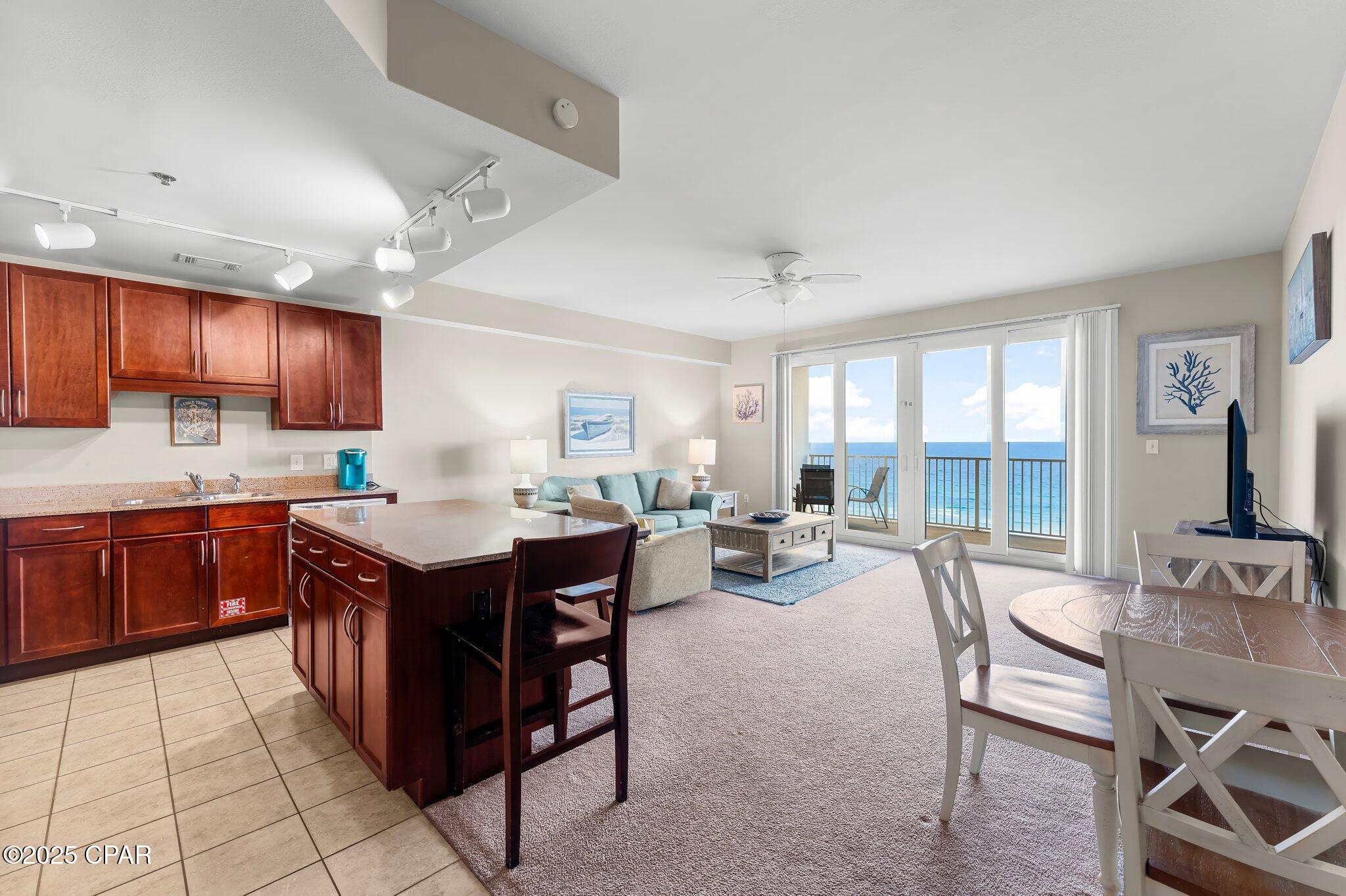 One of the most coveted balcony beach views at Laketown Wharf is already generating over $21,000 a year on a Long Term Rental, maybe more with the right buyer. This well-maintained 1BR/2BA unit includes a bunk room with Barn Door and fully furnished. The kitchen offers abundant cabinetry and a large island, while the living area opens to an oversized balcony with unobstructed Gulf views. Just steps from the sugar white sand via a private beach walkway next to Pineapple Willy's. Resort amenities include Five Resort Style Pools, Splash Bar & Grill, 810 Billiards and Bowling, The Bun Lab, Pickleball, a Gulfview fitness center, covered parking, and a 52,000-sq.-ft. lakefront boardwalk with dining, shopping, and nightly fountain shows. COA dues includes Hazard Insurance, Cable, Internet, Pest Control, Water and Garbage. Have your agent schedule a showing today.