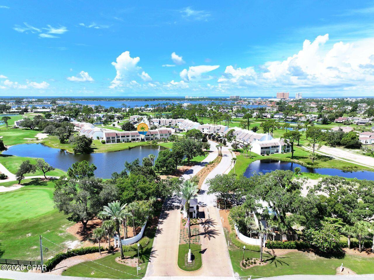 Welcome!  Come enjoy picturesque pond views overlooking the Jack Nicklaus Golf Course from this beautifully situated 3-bedroom, 2.5-bath home in the gated community of Bay Point. In addition to 3 spacious bedrooms, you'll find a versatile bonus room that can easily serve as a 4th bedroom, home office, hobby room, or extra storage. The open floor plan is perfect for everyday living and entertaining.  Enjoy an updated kitchen that opens to your dining area and a spacious living room and large sun porch, all with beautiful views and lots of light.  The sunporch is a great spot to extend relaxing and entertaining, or an inviting multi-functional space that could also serve as a light filled home office, exercise or hobby area.  This golf villa has great outdoor spaces with pond and golf course views, including covered balconies off of two bedrooms, a large back deck, and also features a large front courtyard entry. The covered balconies and spacious back deck are the perfect places to sip a beverage, share a meal, or lounge with a book while taking in your tranquil setting.  The welcoming courtyard entrance is a large space to make your own and also features additional storage closet.  This turnkey golf villa is offered fully furnished and move-in ready for you - even the bikes stay!  Bay Point is one of the area's premier gated communities, featuring 24-hour security, a championship Jack Nicklaus golf course, a full-service marina, on-site dining, and a variety of amenities, all just minutes from the beaches, shopping, and restaurants of Panama City Beach.  Call today and make this your new home at the beach!