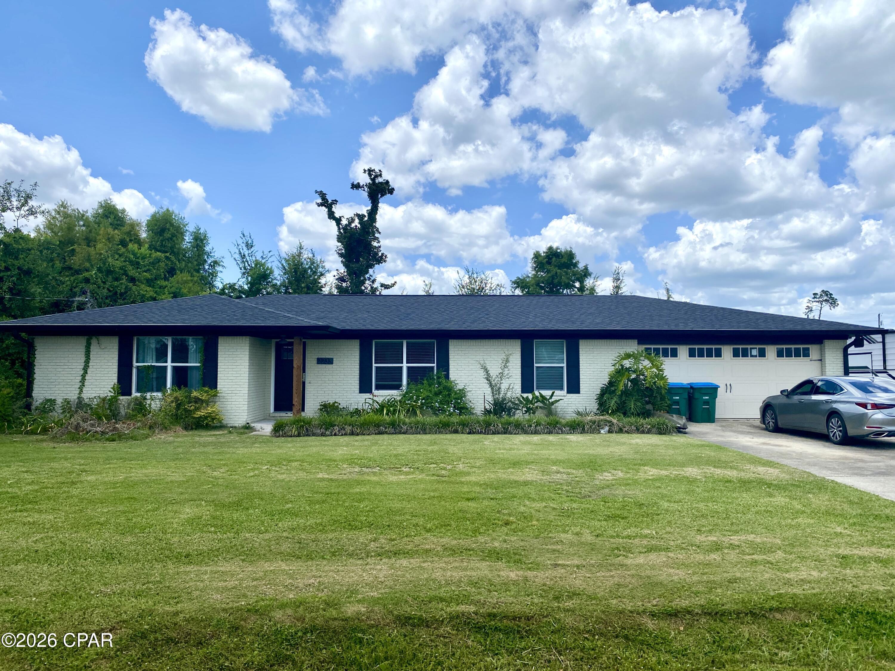 This lovely 3 bedroom, 2 bath home is located in the highly desirable College Point subdivision in Lynn Haven. Just two streets up from the waterfront neighborhood park on North Bay, where you can enjoy easy access to a picnic area, a playground, fishing, kayaking, and stunning sunset views. Inside, this home has been renovated in recent years with a more modern, open-concept design. Lot's of nice features added to include painted wood cabinets, marble countertops, stainless appliances, flooring, upgraded trim work to include crown molding and decorative columns with updated lighting and plumbing fixtures. This home also offers a sunroom just off of the living room with a covered back porch, a nice size laundry room, 2 car garage and a large 100x150 lot. Homes in this sought-after neighborhood are in high demand and rarely stay available for long-don't miss your opportunity to make this one yours. Schedule a showing today!