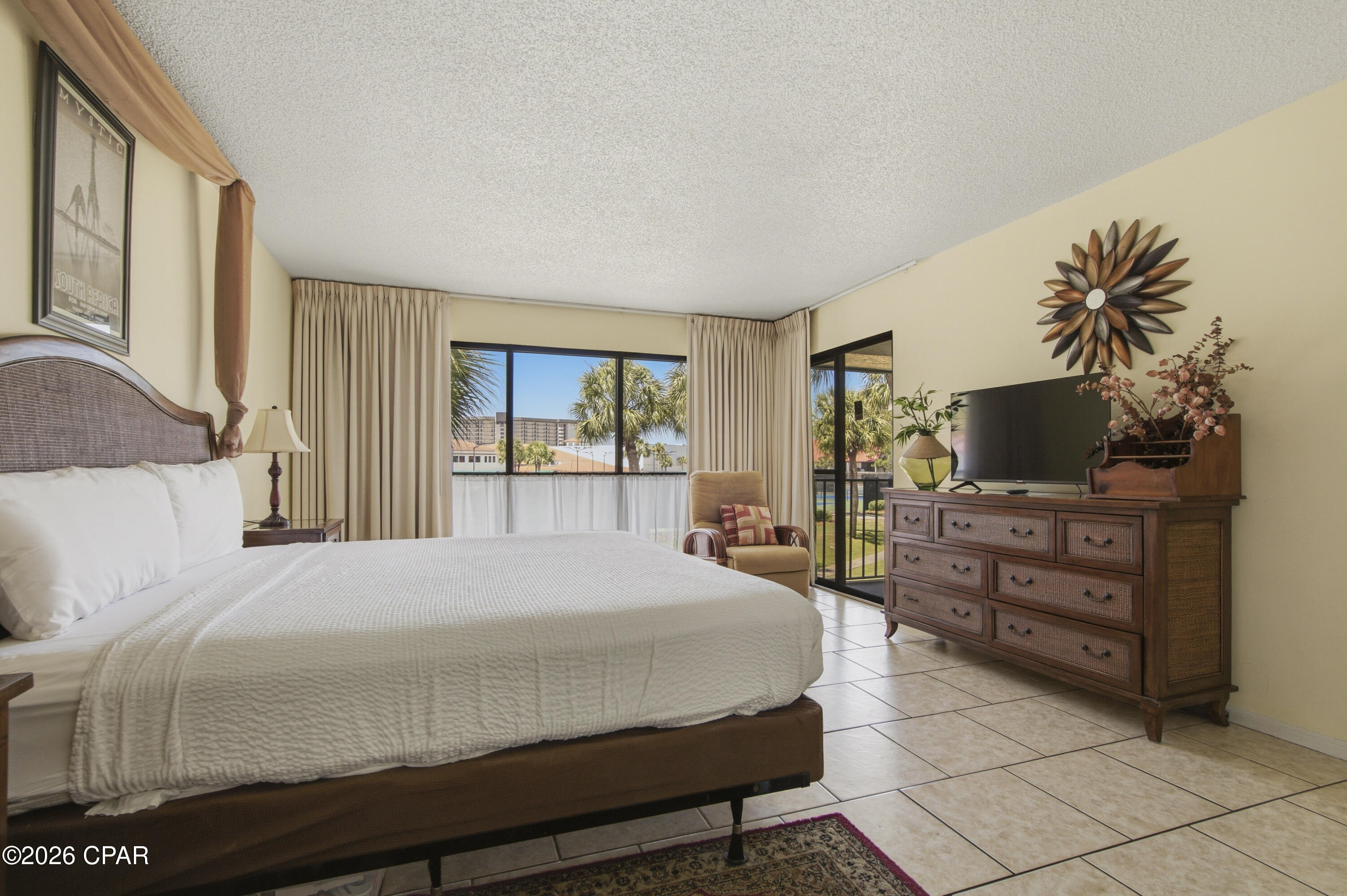 9 Hole Par 3 Golf Included! Your slice of coastal paradise awaits in the sought-after River Oaks phase of Edgewater Beach & Golf Resort! Perfectly positioned for sports enthusiasts, this fully furnished 2-bedroom, 2-bathroom villa boasts over 1,200 square feet of airy, light-filled living space directly overlooking the resort's tennis courts. The updated kitchen is a standout feature, beautifully equipped with modern countertops, cabinetry, appliances, and a large breakfast bar that flows seamlessly into the great room. Floor-to-ceiling windows flood the living area with natural light, leading out to a private back porch, the perfect spot to unwind after a day on the courts or the sand. Turnkey & Fully Furnished: Ready to go with updated living room furniture. Major Mechanical Peace of Mind: Complete HVAC replacement in 2023. Prime Location: Just steps from the tennis center, community pool, and the 9-hole, par-3 golf course. Edgewater is Panama City Beach's premier full-service resort. Take the pedestrian walkway safely over to the sugar-white sands and world-class Gulf sunsets, or enjoy an unparalleled amenity package: a massive lagoon pool, multiple heated pools, hot tubs, a kid's splash pad, pickleball, basketball, shuffleboard, a fitness center, an on-site restaurant, and 24-hour gated security. Located just minutes from Pier Park and the area's best dining, this exceptional villa is a turnkey second home or a lucrative investment opportunity. Schedule your private tour today!
