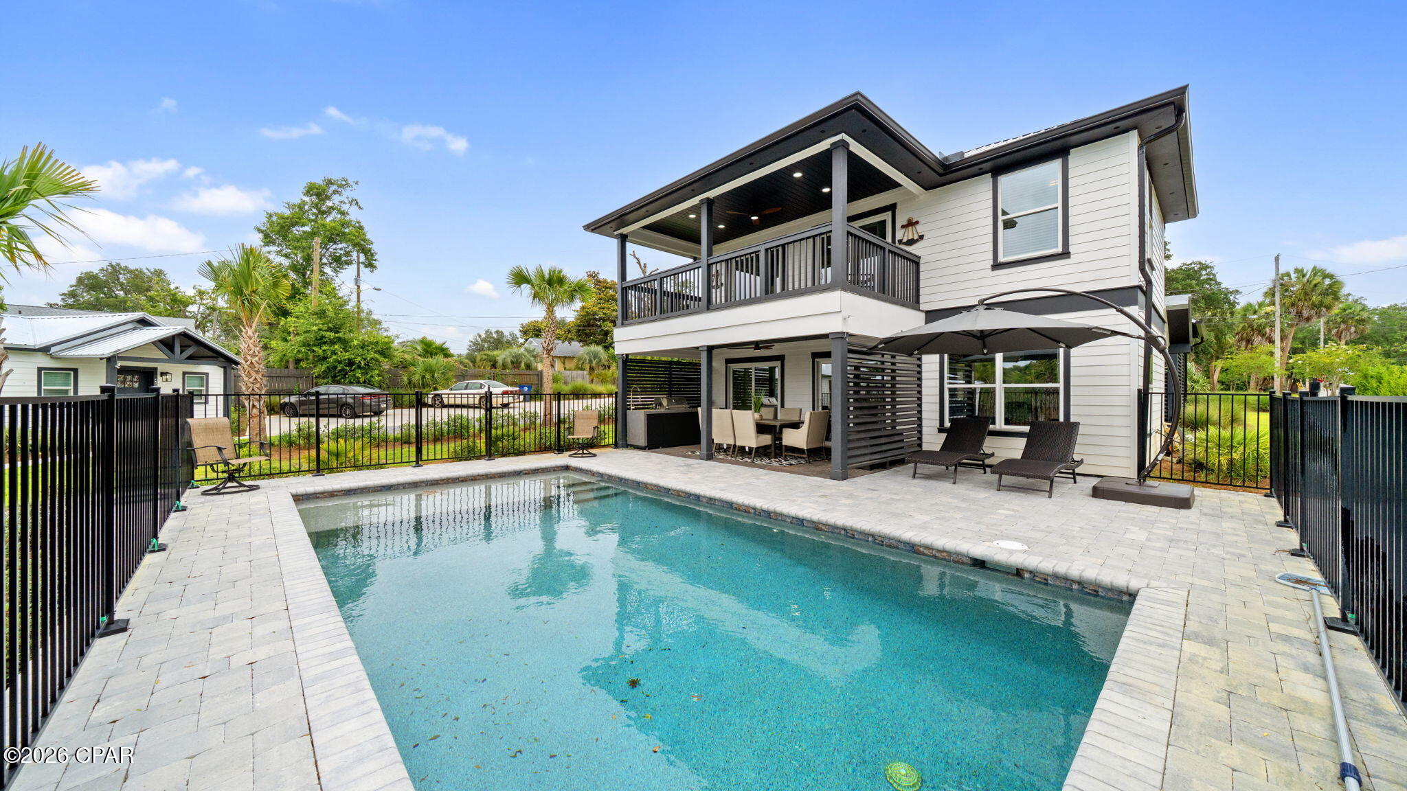 Waterfront masterpiece with deep water access to the Bay and the Gulf of Mexico.
This property is the most versatile home in Panama City with virtually unlimited uses.
Perfect for a primary residence or second home.  Also, the potential for massive short term rental opportunity exists.  Sold fully furnished with all new furnishings.

Built in 2025, this 3-bedroom 2-bathroom with den/office offers gorgeous views from covered porches on both floors. First floor has open kitchen with Forno Italian stainless appliances, large Island, gas stove, double door refrigerator with ice maker and wine cooler. The living / dining walks out large sliding doors to covered porch, outdoor Thor stainless summer kitchen and pool/bayou views. Master bedroom and master bath with large custom shower, double vanity sink and walk in closet. Second floor open family room, den/office, large sliding doors to walk to walk out to covered porch overlooking pool/bayou. Two additional bedrooms and one bath. So much to offer with beautifully designed tile flooring throughout, tankless water heater and extra storage. New custom landscaping and pool to relax and enjoy. Beautiful decking, shared dock with fish cleaning station. Location is easy to access to newly renovated downtown entertainment with shopping, dining, concerts and ongoing festivities. All dimensions are approximate.