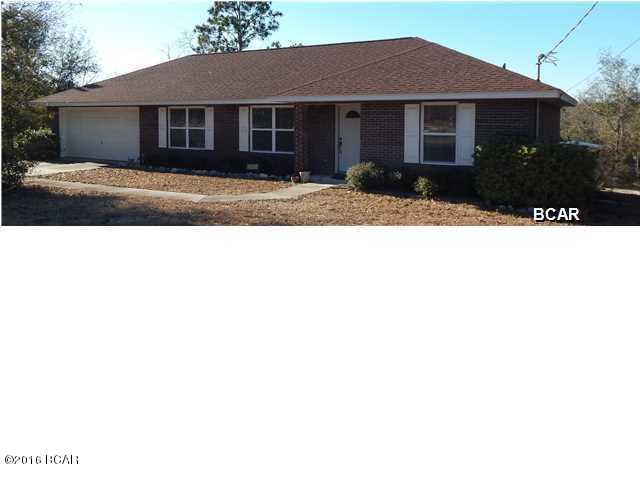 This home is in ''like new'' condition and located on almost 3/4 of an acre in beautiful Sunny Hills! You'll see the quality with this open floor plan and tile flooring through out. Beyond the living area, you'll find a tiled sun room with doors to close it off from the rest of the home. Walking into the kitchen you'll find real wood cabinets and an eat in area. Beyond that you'll find a roomy laundry room and entrance to the garage. The additional bedrooms are roomy with nice closet space. The garage offers extra room for a work area  and an a/c unit that was new in 2015. 

You'll find a chain link fence around the back yard with a storage building. The home is wired for security, intrusion, motion, and fire to save on insurance. Surrounded by golf course so limited development around it.