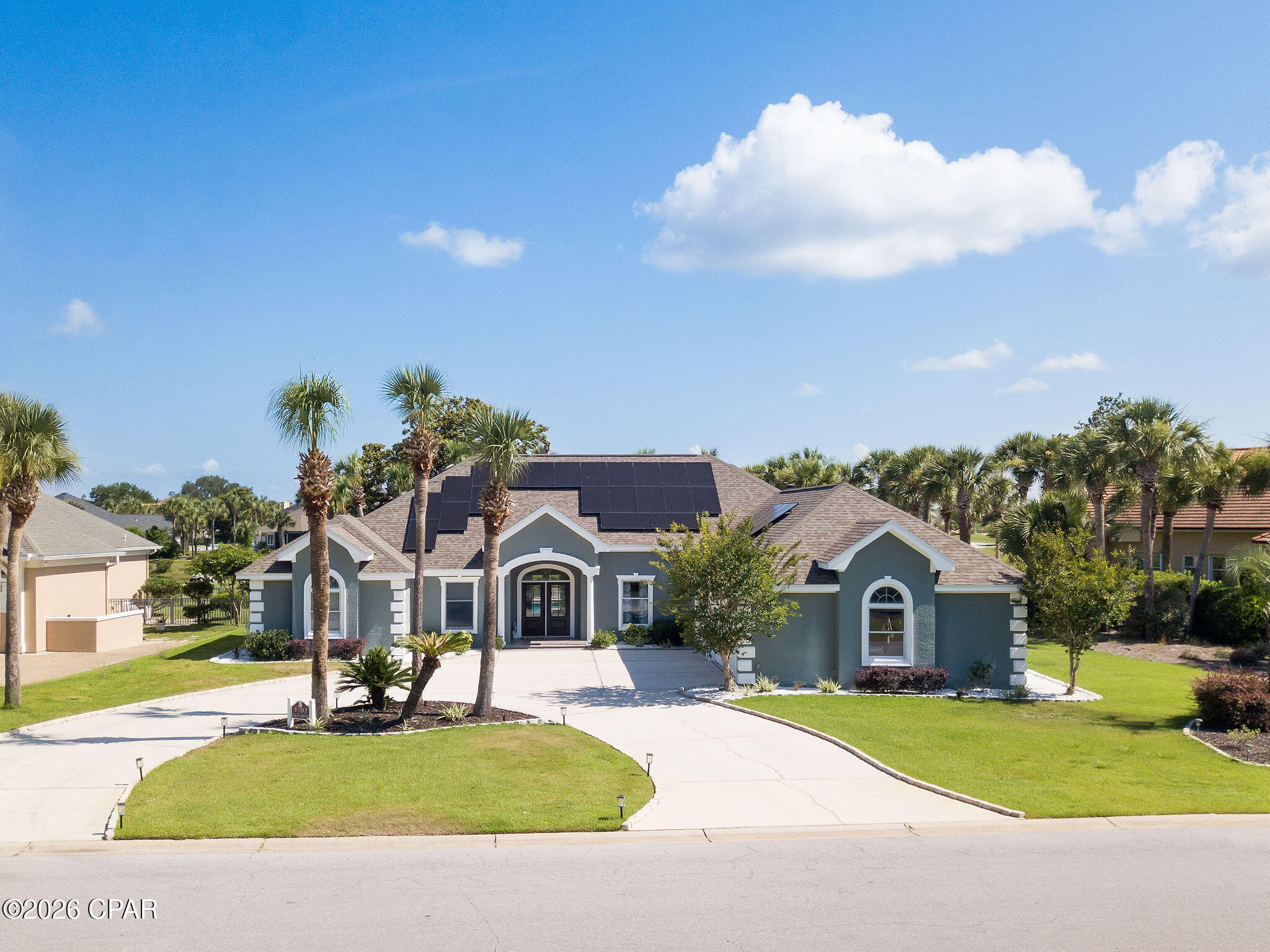 Commanding a premier position along Northwest Florida's only Nicklaus Design course, this nearly 4,000-square-foot Craftsman estate overlooking holes #10 and #11 offers a rare blend of gated golf-community luxury and unmatched energy efficiency.
What truly sets this estate apart from every other luxury home in Bay Point is its fully integrated Solar Power System. Operating on a seamless, transferable lease, this advanced setup provides a powerful financial advantage: it locks in a lower, fixed monthly utility bill, completely shielding you from rising energy costs with an eco-friendly footprint no one else on the course has.
Inside, a wide variety of recent renovations are evident across the expansive five-bedroom layout, highlighted by deep crown molding, fresh exterior and interior paint, a fully new and improved outdoor landscape, and newly installed front-entry doors. The floor plan is highly versatile, featuring two completely renovated bathrooms, an upstairs loft perfect for overnight guests, and a flexible bonus room perfect for a private home office, formal parlor, or greeting lounge.
The back of the home is an entertainer's paradise, where a massive, recently installed porch Lanai encloses a private pool oasis. This outdoor retreat offers uninterrupted views of the green, allowing you to watch the game in complete comfort. Combining turn-key Craftsman style, a prestigious golf-front lifestyle, and an exclusive, low-cost utility advantage, this property is a standout offering.