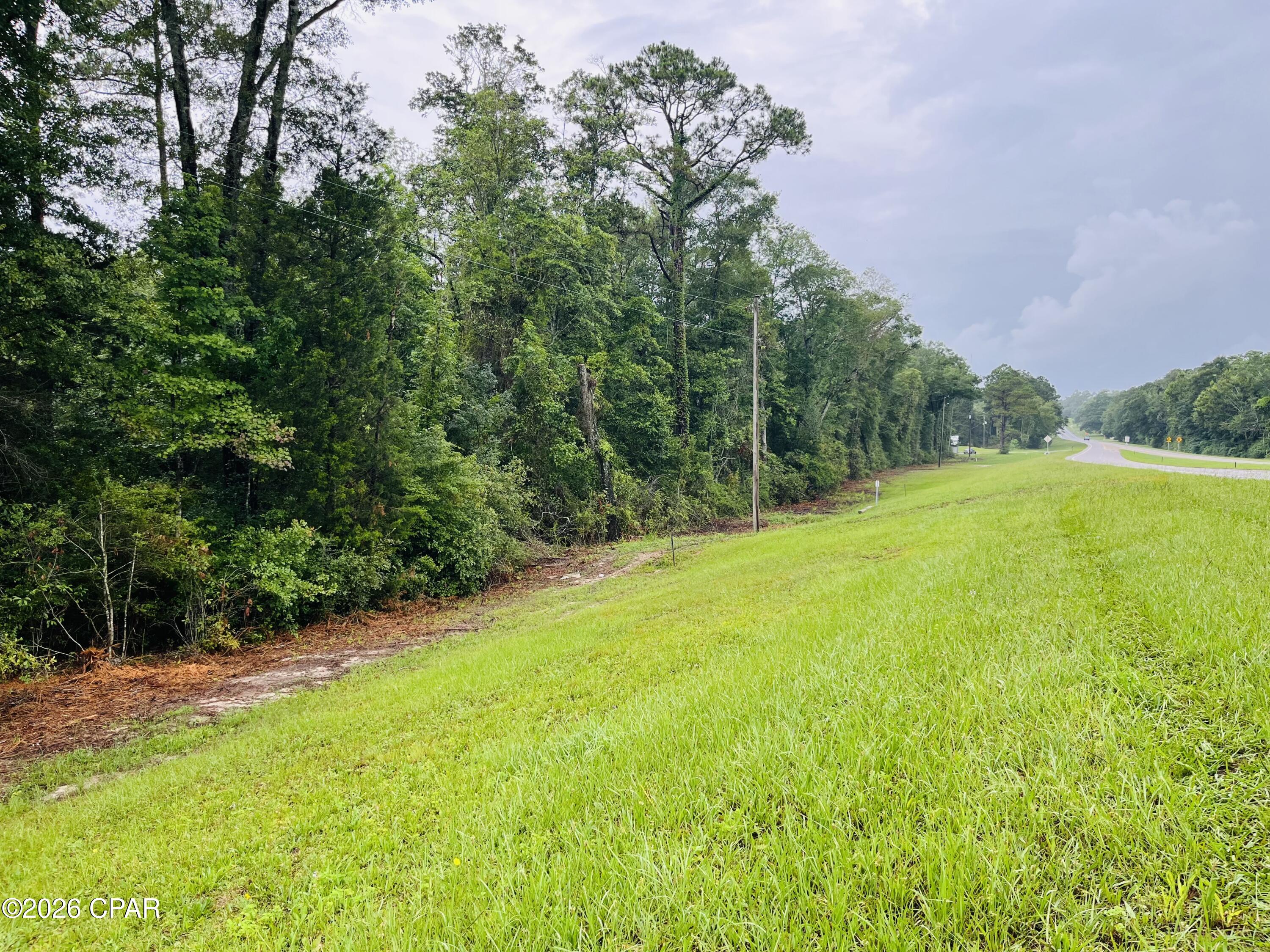 Discover the possibilities with this exceptional 8.42± acre tract ideally located in the heart of Holmes County. Boasting more than 1,000 feet of highly visible Highway 90 frontage, this versatile property offers endless potential for investors, developers, business owners, or those seeking the perfect homesite in a peaceful rural setting.

This untouched parcel provides a blank canvas ready for your vision--whether you're looking to build your dream home, establish a mini farm or homestead, create a commercial venture, or hold as a long-term investment. With ample road frontage and easy access, the opportunities are truly limitless.

Enjoy the tranquility of country living without sacrificing convenience. Situated just approximately one hour from the beautiful beaches and amenities of Panama City, this property offers the perfect balance of rural charm and accessibility. If you've been searching for a prime piece of Florida land with outstanding visibility, development potential, and room to grow, this is an opportunity you won't want to miss.