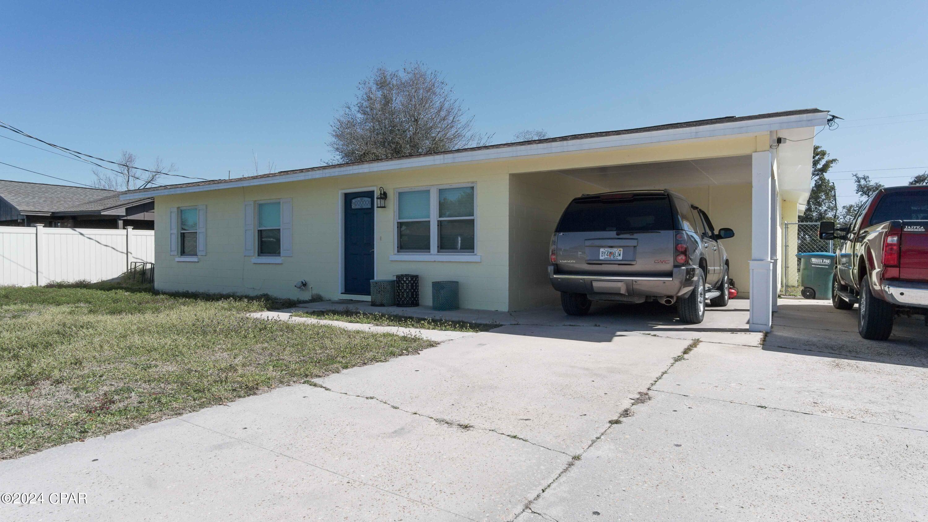 **CURRENTLY UNDER CONTRACT, SELLER WILL CONSIDER BACKUP OFFERS **
Welcome to a renovated solid block residence in Chapel Estates. Downtown and St. Andrews Bay is only a short drive. 
 This property is situated on a spacious 70x289 corner lot, almost half an acre in size. The backyard is accessible from the road and is ideal for a sizable workshop or pole barn for an RV , boats and more !   The residence comprises a living room, an open kitchen with an island, three bedrooms, and a generously-sized den that could serve as a large master suite. The kitchen boasts granite countertops, soft-close cabinetry, and fairly new stainless steel appliances. The bathrooms have been tastefully updated with custom tile showers. The property features an almost 5 year old roof, fresh interior and exterior paint, and ample space for a large family. Additionally, there is a storage shed in the backyard, offering endless possibilities for the backyard space. as you will see in the photos.