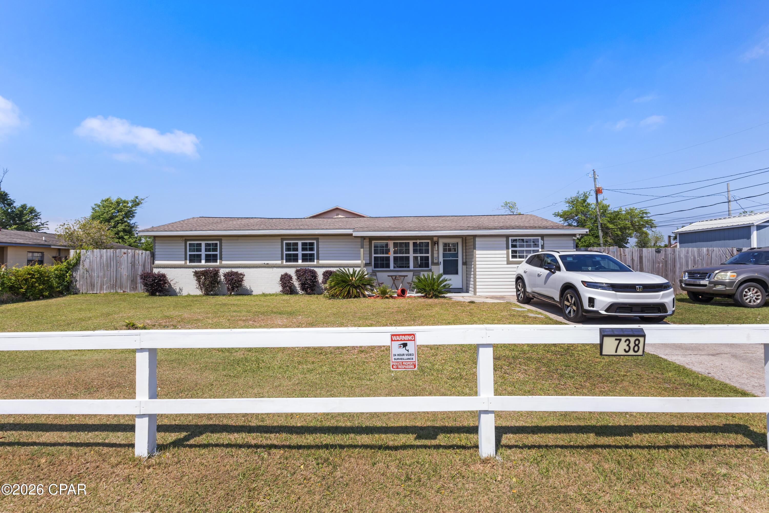 Near Tyndall Air Force Base!!! Welcome to this updated 4-bedroom, 3-bath home with a versatile guest suite, situated on a spacious corner lot.
The layout offers flexibility for a home office, in-law setup, homeschool space, or a larger household. Major updates were completed in 2020, including the roof, flooring, and HVAC system.
Inside, the home features an open-concept living area and a spacious kitchen with granite countertops, an island, stainless steel appliances, and vinyl plank flooring throughout.
The main hallway leads to the primary bedroom, along with two additional bedrooms and a full bath. A separate hallway off the living area provides access to a fourth bedroom or flex space and the laundry room.
French doors off the kitchen open to the backyard and a guest suite with a full bath, suitable as a fifth bedroom, office, or additional living area.
The fully fenced backyard includes an above-ground pool and a gazebo, along with double gates for boat or RV parking.
Square footage includes the rear guest suite. All dimensions are approximate; buyers should verify if important.