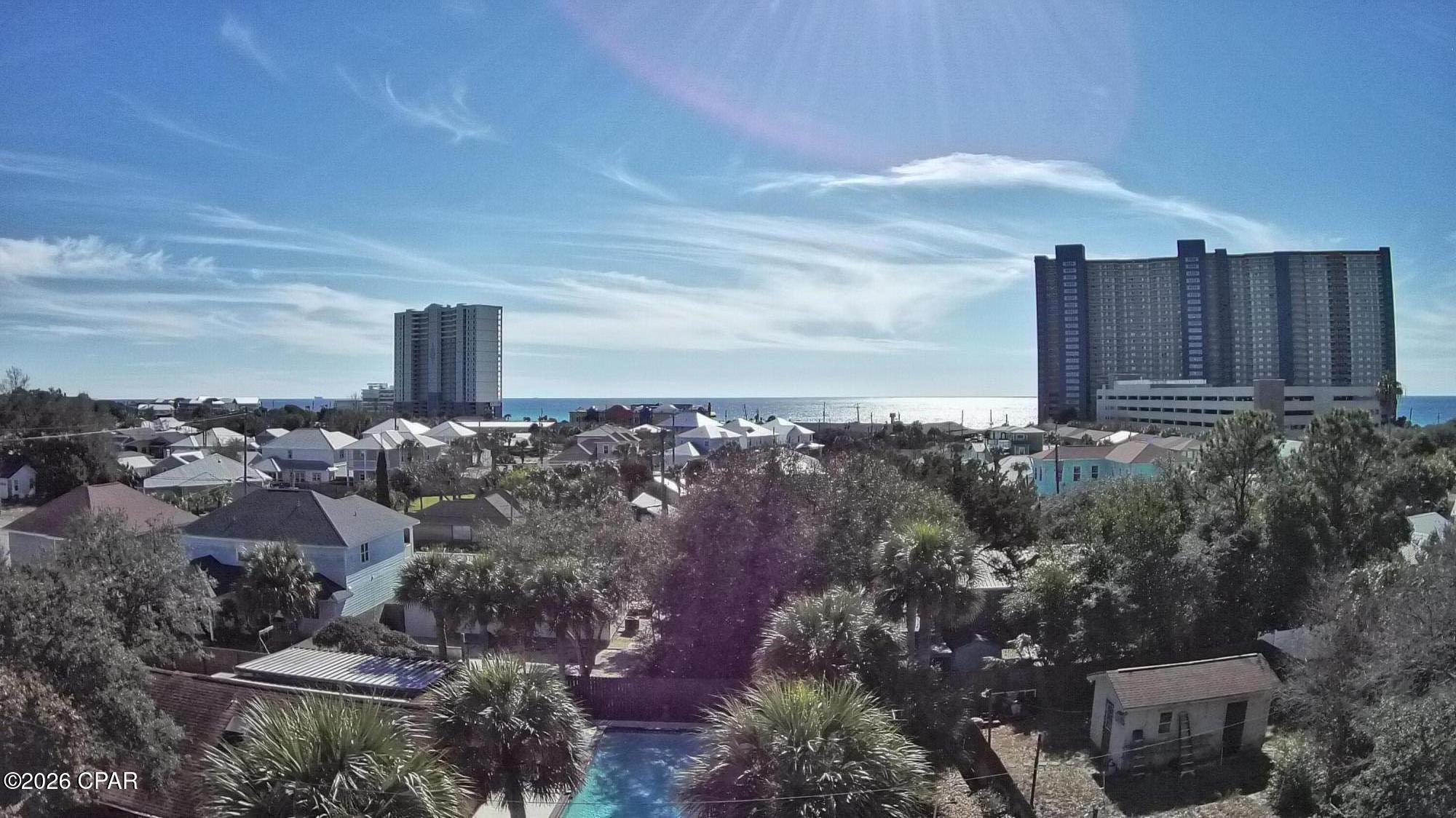 PRICE IMPROVEMENT - Gulf Court Vacant Lot Near the Gulf of America!  Moments from sugar-white sandy beaches, Pier Park, and local restaurants.  Don't miss this rare opportunity to own a cleared vacant lot on Gulf Court, located less than two blocks from the Gulf. Situated in an established neighborhood, this property is ready for your vision, whether you're building a primary residence, vacation home, or investment property.  This is one of the few remaining buildable lots in such close proximity to the beach, now at an even more attractive price.