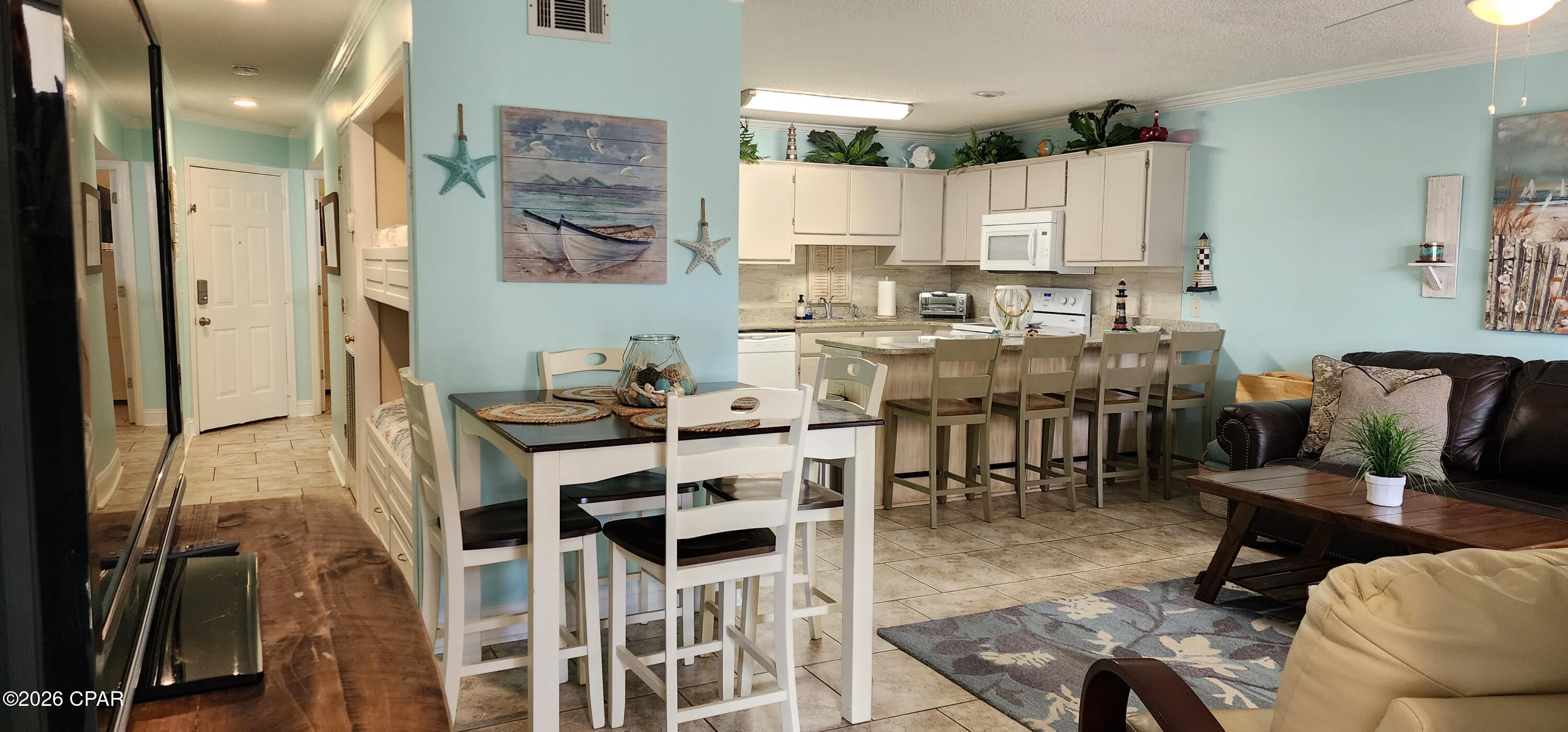 This very well cared for and updated ground floor unit at Horizon South is ready for it's new owner. 1 bedroom and 1.5 bath with bunks in the hallway, the unit can easily sleep 6. Forget the hassle of elevators or long treks across the complex. The unit is located near the entrance, putting you just a 4-minute stroll from the sugar-white sands and emerald waters of the Gulf.  Enjoy a private patio space perfect for morning coffee or storing your beach gear, with no stairs to climb after a long day in the sun.
Whether you're looking for a turnkey vacation rental or a secondary getaway this unit is designed for low-maintenance coastal living. Located on the desirable West End of PCB, you are just minutes away from the upscale shopping and dining of Pier Park, yet tucked away enough to enjoy a quieter beach experience. Horizon South offers 4 pools for its owners and guests along with Tennis Courts and gated community.
