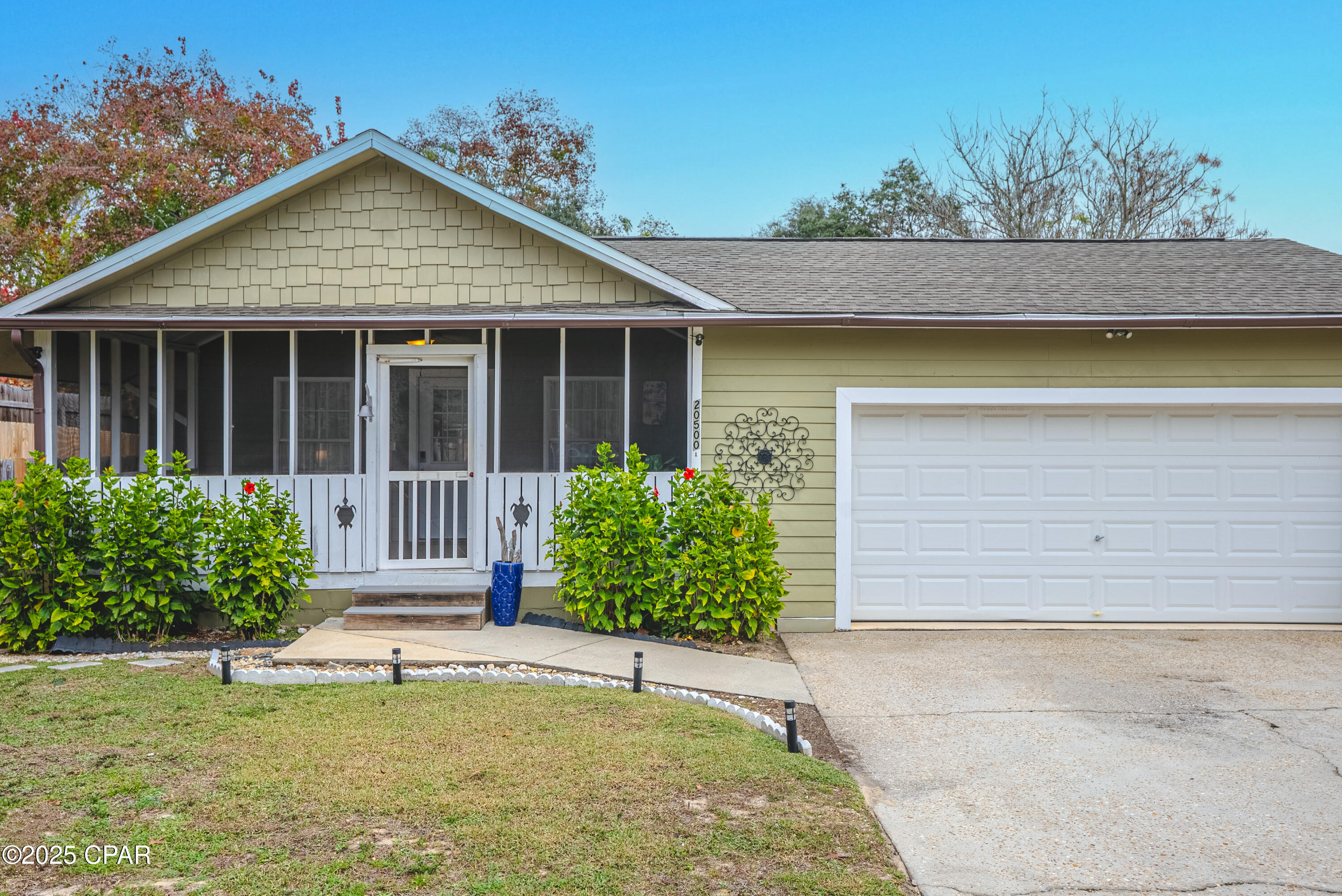 Currently under contract. Seller will consider backup offers.
No HOA. Two Living Spaces. Endless Possibilities.
Less than a mile from the beach, this peaceful, park-like property is a rare find. Tucked beneath mature trees with a tranquil fishpond, the main home is paired with a separate 1-bedroom, 1-bath cottage, offering rare flexibility. It's ideal for rental income, guests, multigenerational living, or a private in-law or home office retreat.

The outdoor living space truly shines with a spacious lanai for relaxing or entertaining, plus a private hot tub to unwind after beach days. With short-term rentals allowed and no HOA, this property offers both lifestyle and income potential.

Additional features include an oversized two-car garage and a prime location just minutes from Pier Park, Topgolf, Pirates Voyage, dining, shopping, and entertainment. Whether you're looking for a primary residence, beach getaway, or investment opportunity, this property delivers versatility, privacy, and pure relaxation! Detached cottage is not included in sf. All measurements to be verified if important.