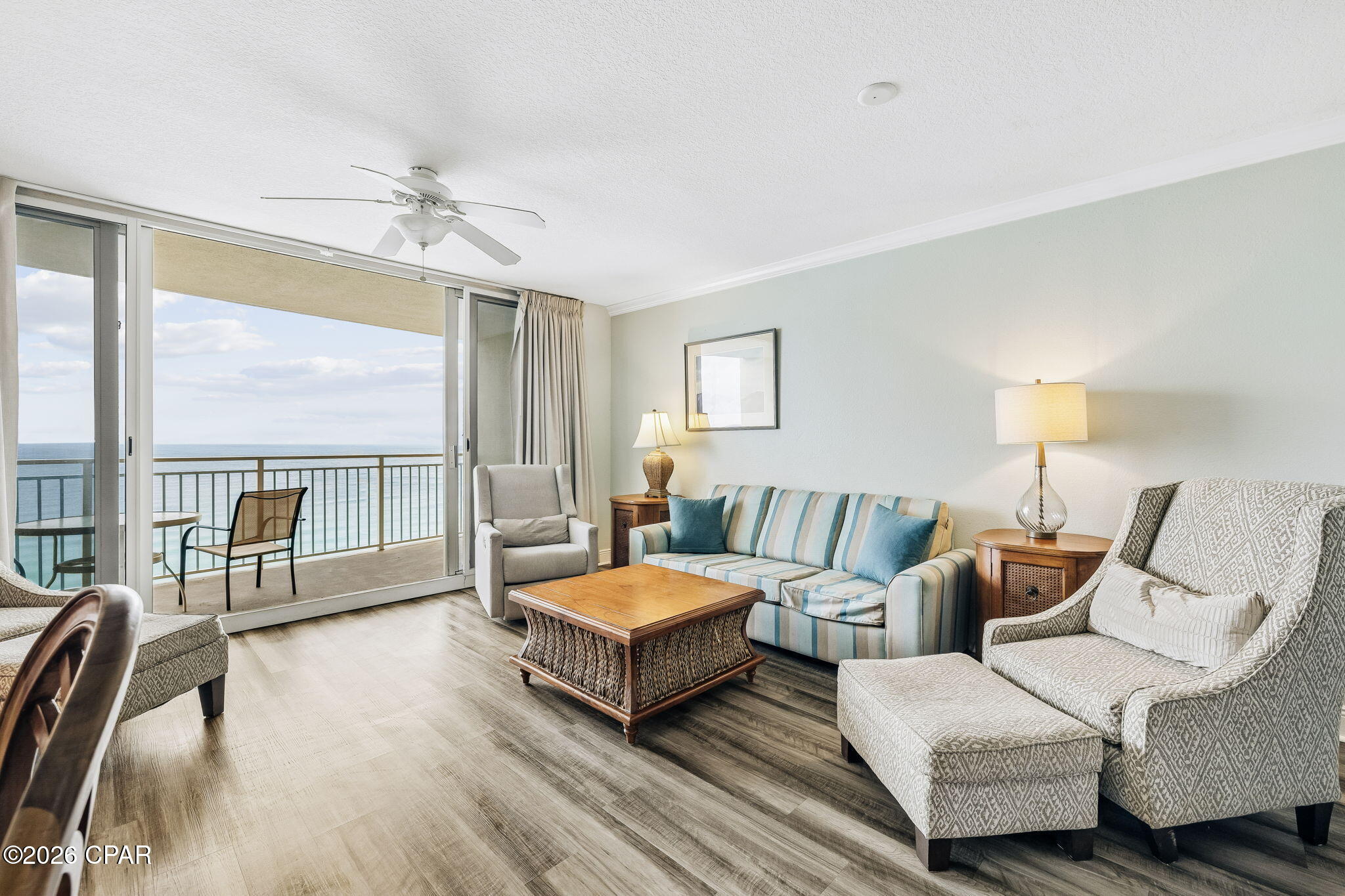 Gulf views from the 15th floor hit differently -- unobstructed, elevated, and framed by 8-foot sliding glass doors that run across the main living area and open onto a spacious private balcony. The kitchen, dining nook, and living space are all oriented toward the water, so the view is part of the everyday experience, not just a balcony feature.
At nearly 800 square feet, the layout is efficient without feeling tight. LVP flooring runs through the main areas, tile in the kitchen and bath -- low-maintenance and built for beach life. A long granite breakfast bar anchors the kitchen and adds seating while keeping the space open.
Sleeping is dialed in for groups: a king primary bedroom, hallway bunks, and a queen sleeper sofa accommodate up to six comfortably. The bathroom's dual-entry design gives the primary bedroom direct access while remaining accessible from the hall.
The HOA covers water, sewer, trash, high-speed internet, and insurance -- keeping the ownership picture straightforward for investors and second-home buyers alike. 
On-site amenities cover the full range: gulf-front seasonally heated pool, zero-entry pool, hot tubs, kids' splash zone, fitness center with steam and sauna, game room, water sports rentals, poolside tiki bar, Starbucks, ice cream shop, sundry store, beach service, high-speed elevators, 24/7 security, and covered parking. If you do decide to head out, you're within walking distance to popular local dining, shops, and attractions, with Pier Park about a mile away.
Easy to enjoy, easy to maintain, and in a spot people come back to year after year. Reach out to take a closer look.