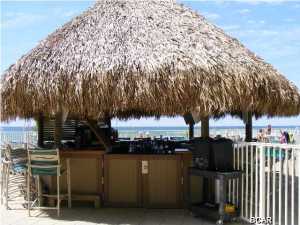 This Emerald Beach Resort 1BD/2BA (plus bunk beds) condo is one of the most beautifully furnished units you will find on the beach! Everything you could ever want in a home, on the sandy beaches of the Emerald Coast is here in this luxury condo unit. From the granite countertops, breakfast bar, crown molding, cultured marble tubs and surrounds, full sized stacked washer and dryer, tile in hallway, kitchen, baths and the large balcony overlooking the emerald waters of the Gulf. The amenities of this Resort include Swimming Pools, Hot Tubs, Tiki Bars, Sky Bar, StarBucks's Coffee Shop, Fitness Center/Spa and within a mile of great shopping at Pier Park. Owners have just finished updating the condo with a new sleeper sofa, coffee table, chair, lamps and new bedding and linens in