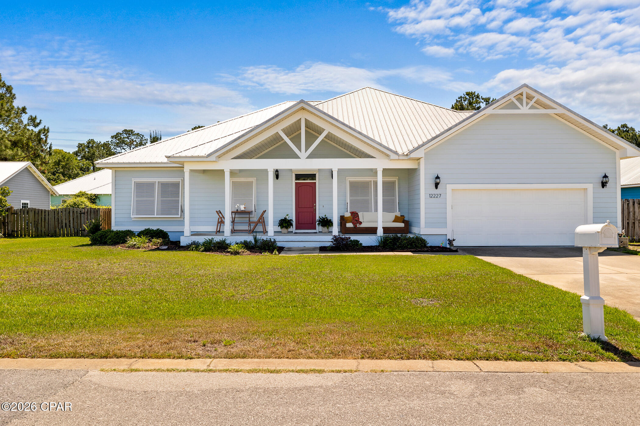 Plantation-Style Home on an Exceptional Oversized Lot Near the Beach
Positioned on one of the largest homesites in the neighborhood, this beautifully maintained 4-bedroom, 3-bath residence offers 2,250 square feet of thoughtfully designed living space just minutes from the Gulf and approximately two miles from Pier Park. Tucked within a quiet community off PCB Parkway, the setting combines privacy, convenience, and low HOA dues.
A welcoming covered front porch opens to a spacious foyer and an impressive 18' x 22' great room. Elevated 11' ceilings, crown molding, recessed lighting, and plantation shutters create a bright and refined interior, while the open-concept layout allows for effortless flow between living, dining, and kitchen spaces.
The kitchen is designed for both function and style, featuring solid wood cabinetry, granite countertops, stainless steel energy-efficient appliances, a natural gas range, a large island with pendant lighting, and a walk-in pantry.
The primary suite offers a quiet retreat with elegant finishes, including crown molding and recessed lighting. The ensuite bath includes a tiled walk-in shower, garden tub, and double vanity. A separate guest suite with a private bath and walk-in closet provides ideal accommodations for visitors.
Outdoor living is equally inviting, with a covered 25' x 11' rear patio overlooking the expansive backyard. The scale of the lot offers flexibility for entertaining, storage, or future enhancements, all supported by a full irrigation system. A large storage building adds additional utility without compromising space.
Additional highlights include:
Brand new HVAC system, 2025
Brand new water heater, 2025
Durable metal roof, Low-maintenance Hardie board siding, Plus, oversized two-car garage.
This property delivers a rare combination of interior space, outdoor scale, and proximity to the beach, dining, and entertainment.
Schedule your private showing to experience it firsthand.