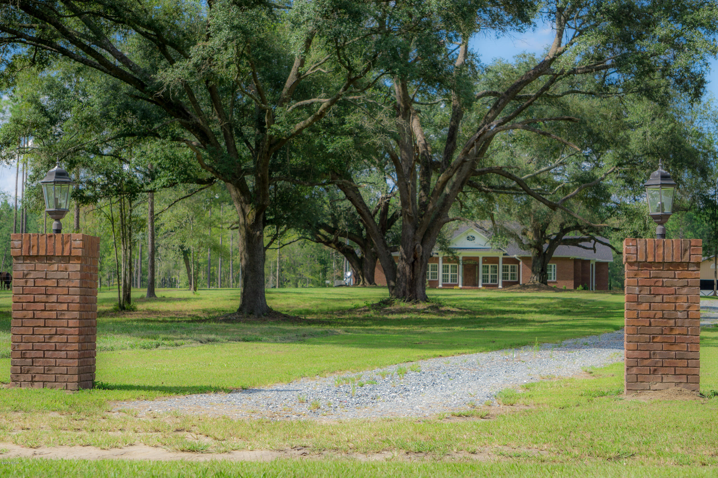 Beautiful equestrian estate! If you are looking for a place for your family with lots of space for riding or just to enjoy the outdoors, this is it! Custom 2400+ sf 3BR/2BA brick home built in 2013 on 19.2 acres. Private setting with beautiful large oaks all over the property and lots of wildlife. Open floor plan, 9’ ceilings throughout with decorative tray ceilings, crown molding, gas fireplace, hardwood floors, custom tile, stainless appliances, granite, large windows for lots of natural light, and much more. Luxurious master suite. Separate study with custom built-ins. 300+ sf screened porch. Large 40’x60’ barn is ideal for horses, equipment, workshop and more. Located in private, equestrian-friendly, gated community northwest of Bonifay. Only an hour to Panama City airport and be floors, custom tile, with carpet in the bedroom areas. Beautiful 300+ sf screened porch overlooking pasture and wooded areas.19.23 acres, with approximately 7 acres in fenced pasture. Beautiful large oaks all over the property, lots of wildlife. Large 40'x60' barn with brick accents, 2 horse stalls (room for more) with rubber mats and automatic waterers. Two enclosed 12'x12' rooms that can be used as tack room, shop or storage. Plenty of open area for equipment storage.Located northwest of Bonifay in a private, gated community. Miles of grass roads perfect for riding. Approximately 1 hour from Panama City airport and beaches.