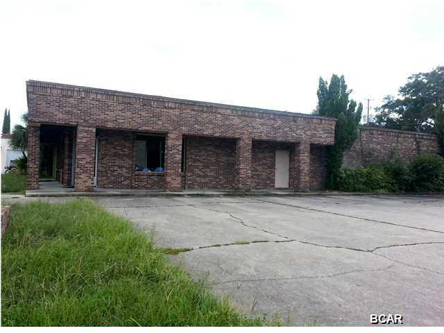 **All measurements taken from property appraiser web site. Buyer to verify if important.** Located on busy Harrison Ave in downtown Panama City, this approx. 5319 sq.ft space could be the perfect location for your business! Approximately 3655 sq.ft of heated/cooled space. The main room, which was the retail space, measures approx. 40x28. Behind that is a work room measuring approx. 28x44 with a kitchenette and bathroom. There are also two existing offices. 10 ton AC with newer compressor. Roof redone in 2004. There are 2 storage units on the side-one is wired for electric.