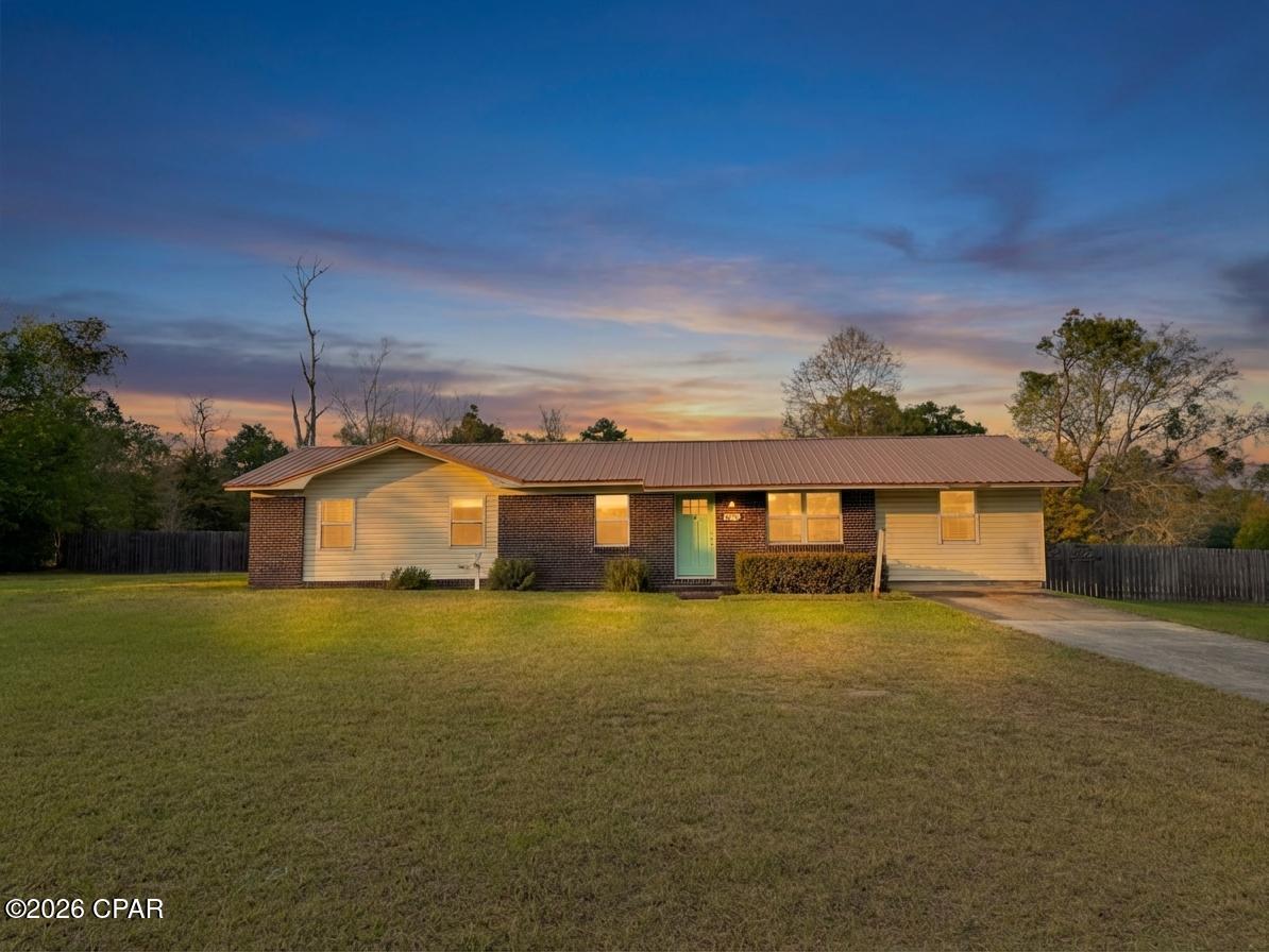 CURRENTLY UNDER CONTRACT, SELLER WILL CONSIDER BACKUP OFFERS

Welcome to this charming home in the desirable Dogwood Heights subdivision in Marianna, known for its spacious lots and unbeatable convenience to local schools and downtown.

Situated on a generous 0.9+/- acre lot, this 2-bedroom, 2-bathroom home offers plenty of room to spread out both inside and out. The fully fenced backyard is ideal for pets, gardening, or simply enjoying outdoor living with family and friends.

Inside, you'll find thoughtful updates throughout. The kitchen features updated cabinetry and stainless steel appliances, while the home boasts laminate wood flooring for a clean, modern feel. Major improvements have already been taken care of, including a water heater just 3 years old, a durable metal roof only 7 years old, and updated windows for added efficiency and comfort.

In addition to the two bedrooms, there is a versatile flex space--a converted garage area--that could easily serve as a home office, playroom, or be modified to create a third bedroom with the addition of a closet.

With its combination of updates, flexible layout, and large lot in a sought-after neighborhood, this property offers both comfort and potential. Don't miss your opportunity to make it your own!
