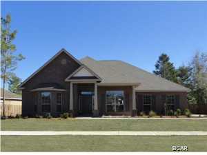 RARE LAKE LOT!! MOST POPULAR FLOOR PLAN,The McKenzie, WITH A SUNROOM AND ADDITIONAL BACK PORCH!!!! Upon entering the foyer you will realize that this home is like no other. The wide foyer with double arches setting off the dining room is every elegant. This home was designed with entertaining in mind. The family room and kitchen are open to each other with a long wrap around bar dividing the space. You will love preparing family meals in the gourmet kitchen with stainless steel appliances, 3 cm granite, designer cabinets, and a huge island. There is a covered back porch that is 24 foot wide overlooking the beautiful corner lot. The master suite is huge with everything you are looking for: garden tub, separate tiled shower, linen closet, and walk in closet, water closet, trey ceiling