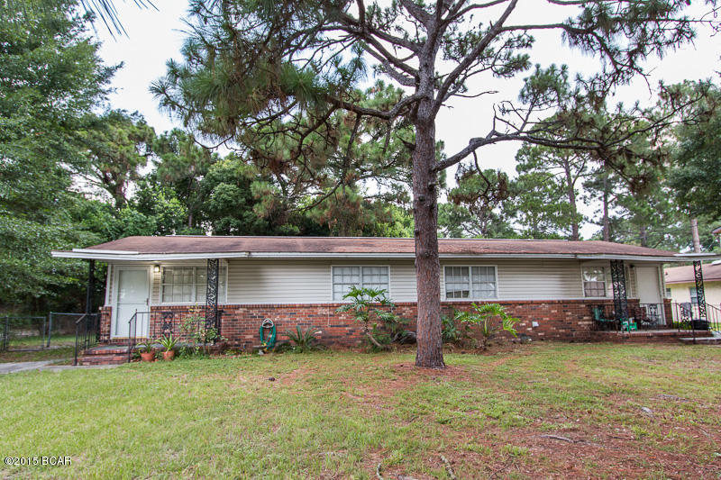 GREAT INVESTMENT! This property is currently bringing in $1,550 a month, with the potential to bring in more. The right side was recently updated with new floor and paint. It is being rented for $800/month. The left side (pictures are of this unit) is being rented for $750. Both are in very good shape and have large, fenced in back yards.  Both units are two bedroom, one bath. This duplex is located north of 23rd in a good neighborhood and very centrally located. Property is all electric and has city water. One lease will be up in just a few months so purchasing this to live in and rent one side out is a possibility. The rent from your tenant would cover your principal and interest payment!