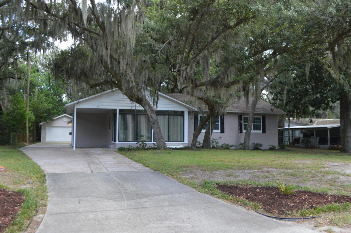 Charming Cove home with many updates. Roof 2010, Windows 2010, Pump and well 2011, Electric AC and Gas heating 2012, Kitchen appliances 2014, Deck and paint 2015. Everything is completely ready for the new owner! The home features a nice sunroom that overlooks the beautiful front yard with a large oak tree. There is an outside storage area and a small metal building. In addition, there is a LARGE 20x30 Double Car garage/workshop that was added in 2004. It is clean as a whistle and is perfect for entertaining or using as a workshop. The home is just a few blocks from the water and near the St. Andrews Bay Yacht Club.