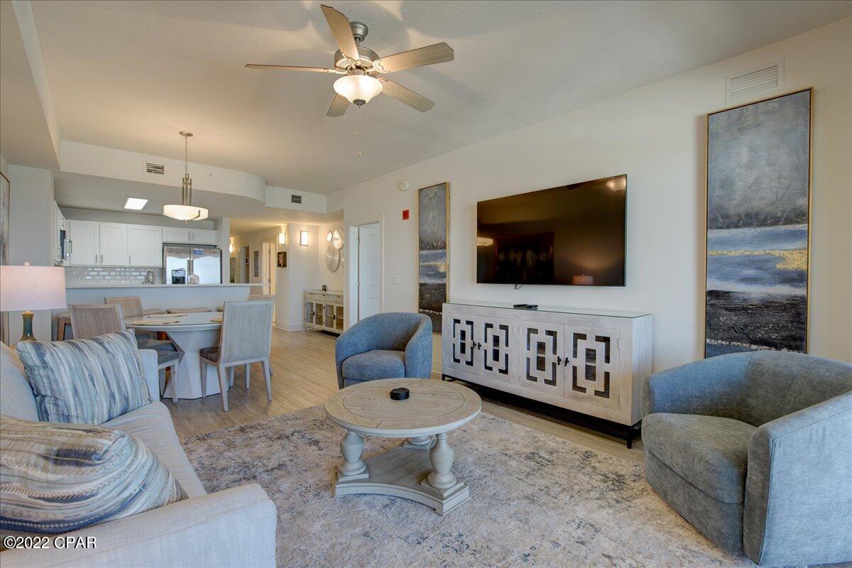 Price Reduction!  Higher Floor, on this brand new unit, less than a year old! A great floor unit with wide angle views of the gorgeous Gulf of Mexico and Pier Park. This unit is professionally furnished, with a great taste of luxury furnishings. This unit is rental ready! Interior features vinyl plank flooring, stainless steel farm sink, quartz countertops, stainless steel appliances, and full size washer and dryer. The project offers a great fitness room with all equipment needed for an amazing workout, restaurant with al fresco dining, 2 Tiki Huts/Bars, 9 Cabanas for daily rental from the onsite rental company. In addition, the beautiful zero entry pool that is heated in the colder temperatures and light changing in the night!
