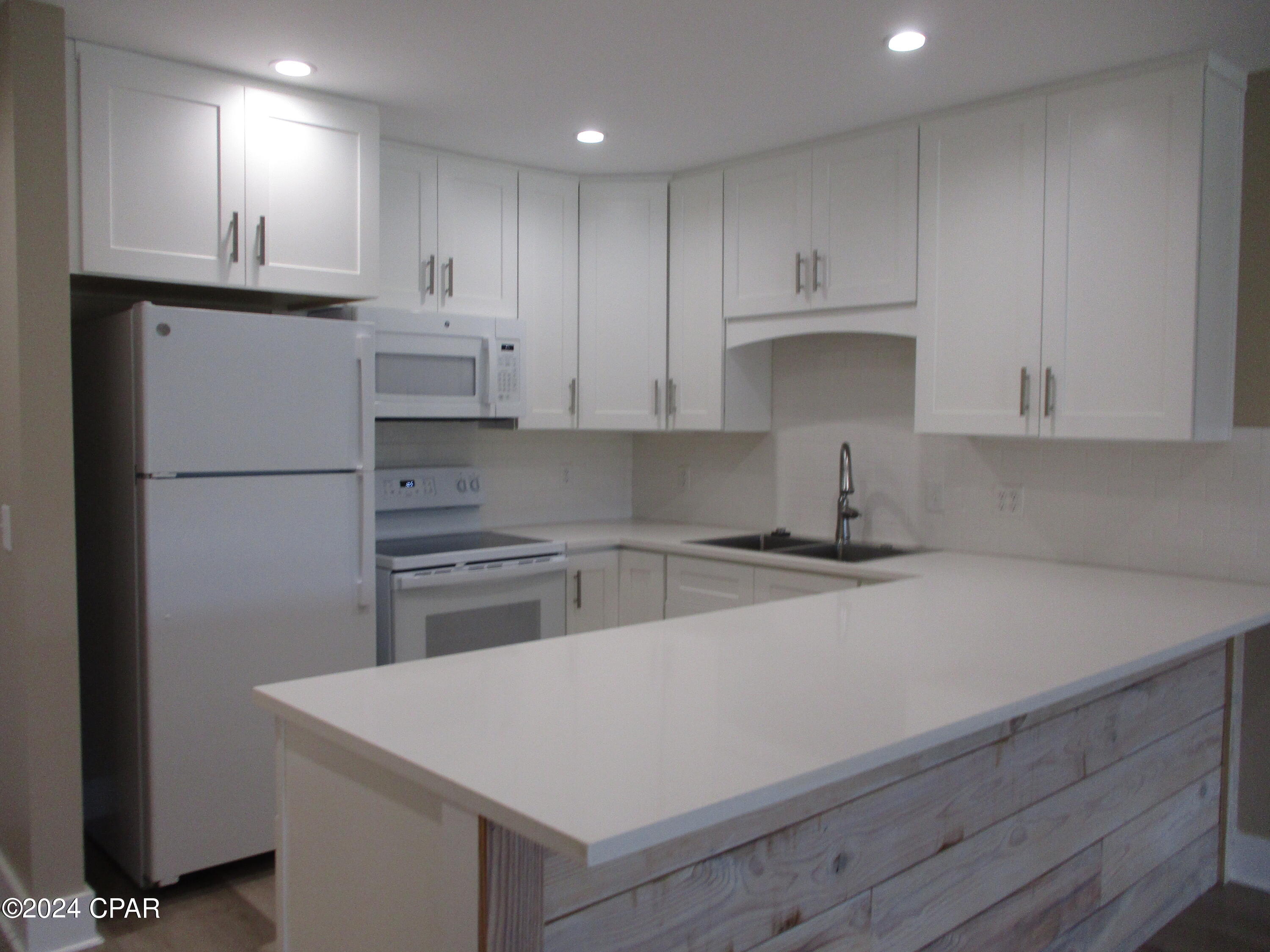 Spacious 1 bedroom on the Ground floor in gated Bay Point! Sit on your patio and enjoy golf course views or walk across the street to the Marina!  This just like new condo has one bedroom with office or bonus space,  a full bath with walk in shower and an additional  dressing area with vanity and sink. New electric ,plumbing, appliances, instant tankless water heater , floors and more! 
Internet, water, trash included. Tenant responsible for only electric. One small dog allowed. Non smoking property. Minimum one year lease required with tenant maintaining rental insurance.  Bay Point is a gated community with a full service marina, golf, a great restaurant and is located close to Navy Base  and all in Panama City Beach!