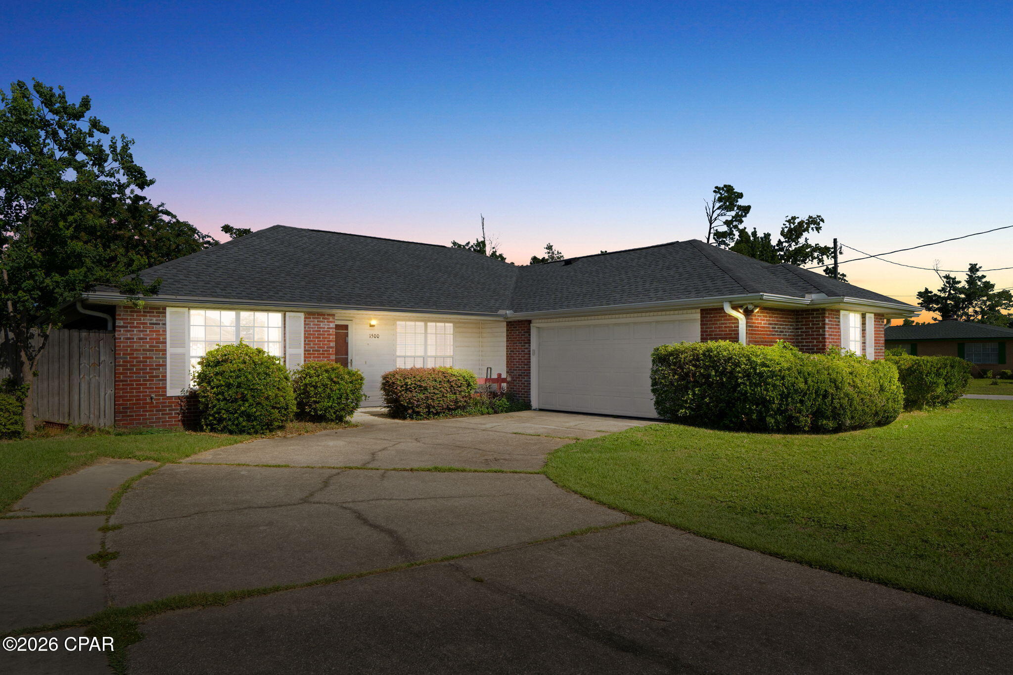 Steps away from Cain Griffin Park and its beloved splash pad, this 3 bedroom, 2 bathroom home offers the perfect blend of comfort, space, and an unbeatable location in a quiet Lynn Haven neighborhood. Inside, you'll find 1,500 sq. ft. of thoughtfully designed living space with a split floor plan for added privacy. New LVP flooring flows throughout the main living areas. The spacious primary suite is a true retreat, featuring an en-suite bathroom with dual sinks, a walk in shower, and a generous walk-in closet. Major peace of mind comes standard here: the roof was brand new in 2025, and the home is move-in ready. Step outside to your own private oasis, a screened-in patio overlooks a large, fully fenced backyard complete with a shed and a playground, ideal for kids, pets, and weekend get togethers. The attached 2 car garage offers convenient parking and storage, and an interior laundry room adds everyday ease. Zoned for some of the area's best schools and just minutes from local restaurants, shopping, and parks, this home puts you close to everything Lynn Haven offers while remaining tucked into a peaceful neighborhood. With the park and splash pad practically at your doorstep, this is the kind of location that's hard to find twice.
