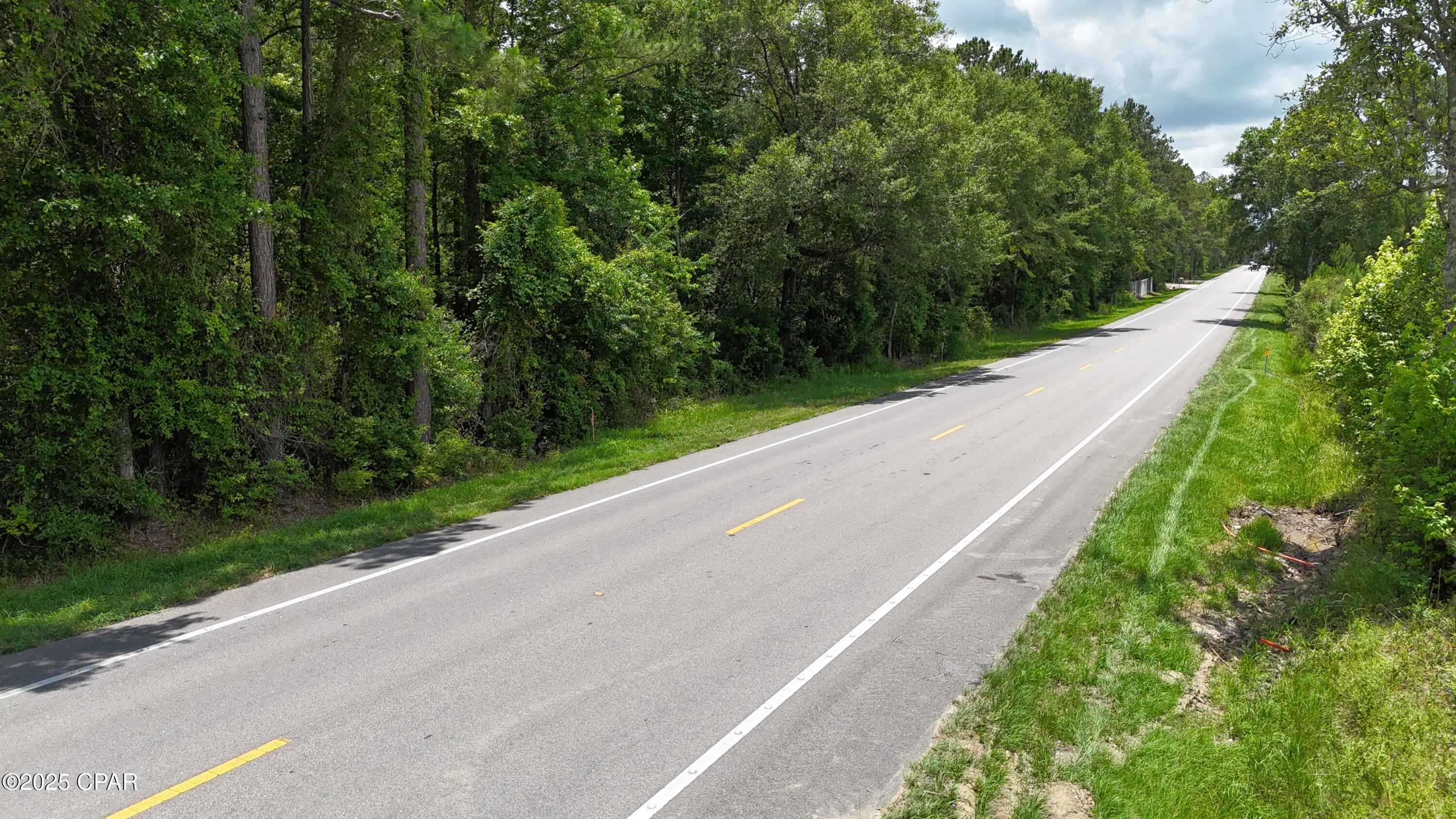 This stunning 19-acre parcel of land offers a perfect blend of natural beauty and accessibility. Nestled just 45 minutes from Dothan, Alabama, you'll enjoy the convenience of nearby shopping and dining options. With its wooded, dry terrain, it provides an ideal setting for both hunting enthusiasts and those seeking to build their dream home. The property boasts prime highway frontage, offering easy access and a direct route down Highway 79 to the breathtaking beaches of Panama City. This land presents a wonderful opportunity to embrace a tranquil lifestyle while being just an hour away from the world's most beautiful beaches.