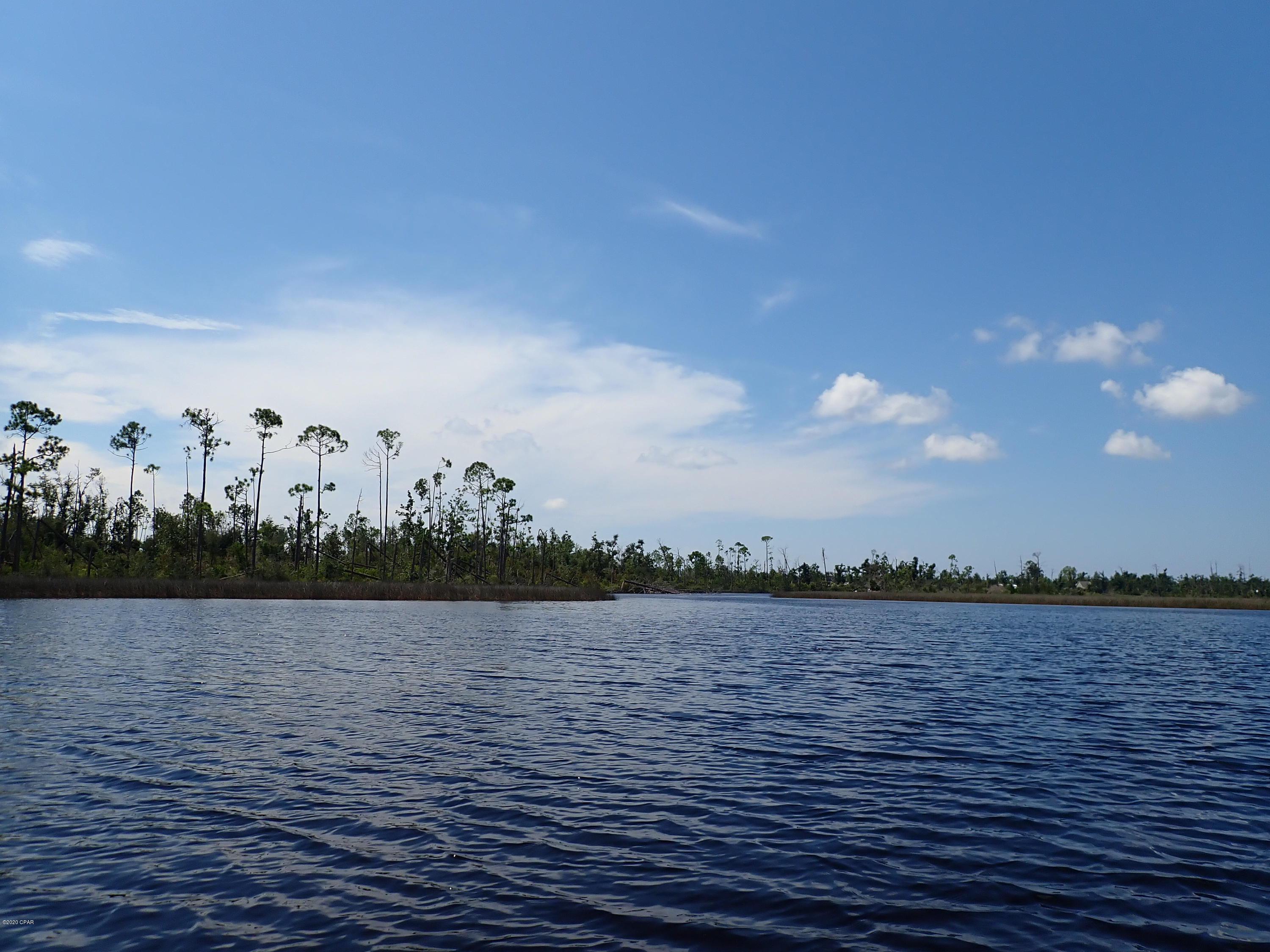 Waterfront Development opportunity with access to East Bay and the Gulf of Mexico. With over 5,600 FF on Cook's Bayou, the property has a mixture of Oaks, Magnolia and Pines. +/- 150 upland acres located on a bluff along the waterfront. The majority of the uplands is Zone X or outside of the 500 year flood zone. The property is zoned Conservation Habitation at 2 units per acre or 514 units. Cook's Bayou Bridge has been raised to 9'6''. An upland cut marina with slips, docks and dredging could be entitled as part of the development. Located near Eastern Shipbuilding recently awarded a $10.5B US Coast Guard contract, 20 minutes from Tyndall AFB which is being rebuilt post hurricane with an expanded mission resulting
in an additional 4,000 jobs.