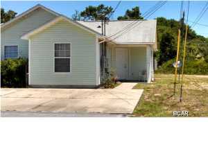 Nice duplex located in North Grand Lagoon, only minutes from the worlds most beautiful beaches. Duplex has 2 bedrooms, 2 baths, full size washer dryer hook-up and vaulted ceilings. Open kitchen and living/dining room are completely tiled along with the bathrooms and laundry. Vaulted ceiling in the living area, double paned windows, walk-in shower in one bath, and newer oven/stove and microwave are all added features of this North Lagoon duplex. Pets are allowed; breed restrictions apply.