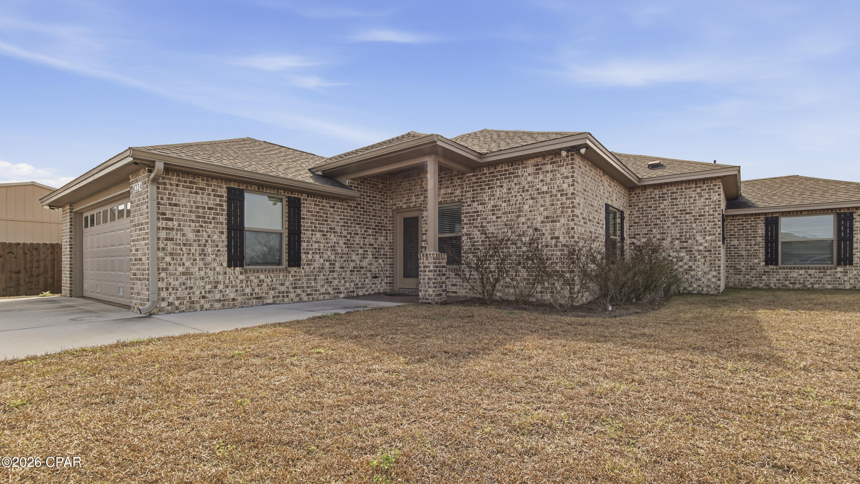 Welcome to 4224 Dairy Farm Road in the welcoming community of Bylsma Manor Estates, conveniently located just off U.S. Highway 231 in Panama City. Built in 2023, this brick home offers 1,848 square feet of beautifully designed living space and has never been lived in -- giving you the rare opportunity to own a truly move-in-ready, like-new home.
This 3-bedroom, 2-bath residence features durable vinyl plank flooring throughout and a spacious, open-concept layout ideal for entertaining. The inviting living room showcases a cozy electric fireplace and flows seamlessly into the kitchen and dining area.
The kitchen is both stylish and functional with granite countertops, stainless steel appliances, white shaker-style cabinetry, and a breakfast bar perfect for casual meals or gathering with guests. The washer and dryer convey with the home, adding immediate convenience.
The 13' x 15' primary suite offers a vaulted ceiling, generous walk-in closet, and a private en-suite bath complete with a double vanity and beautifully tiled walk-in shower. The second bathroom includes a fiberglass tub/shower combination, ideal for family or guests.
As an added bonus, this home features a large 13' x 19' separate family room -- a versatile space perfect for a home office, gym, media room, playroom, or anything you envision.
Additional highlights include a 2-car garage and a prime location close to shopping, dining, and schools. Everyday conveniences such as Publix, Starbucks, and numerous restaurants and businesses are just minutes away.
Residents of Bylsma Manor Estates enjoy no HOA fees, no flood insurance required, low property taxes and underground utilities -- making this home an exceptional value. Don't miss your chance to own this beautifully crafted home in a convenient and growing area.