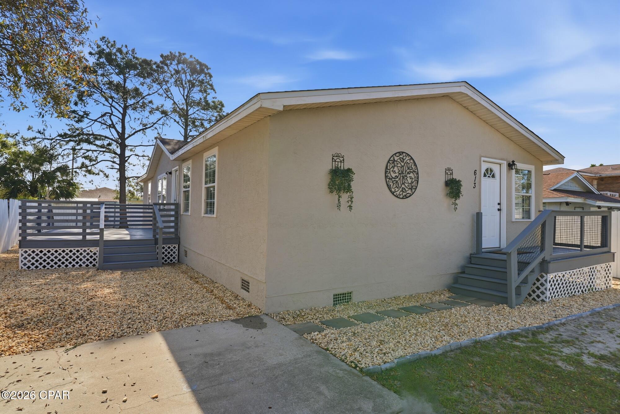 NO HOA & SHORT TERM RENTAL READY!! Welcome to 613 Gardenia Street in Panama City Beach--where location and style come together. This beautifully renovated home is move-in ready and just steps from the Gulf.

Inside, you'll find new flooring throughout, an updated kitchen, and a refreshed bathroom, all designed with a modern coastal feel. The home also features a charming shiplap ceiling, fresh interior paint, and newly painted exterior for standout curb appeal. Major upgrades including a new AC system and updated electrical add comfort and peace of mind.

Perfectly positioned, this home is just steps away from Beach Access 44, as well as local hotspots like The Salty Goat and The Pour--making it easy to enjoy the best of beach living.

Whether you're looking for a primary residence, vacation retreat, or investment opportunity, this property offers the ideal blend of convenience, updates, and coastal charm.