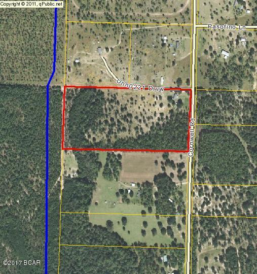 Large 20 acre ranchette located near Alford. Well and septic tank located on property. Front of property cleared with hardwoods in rear of property hiding head water of a flowing spring across the rear.Great location to homestead!!!