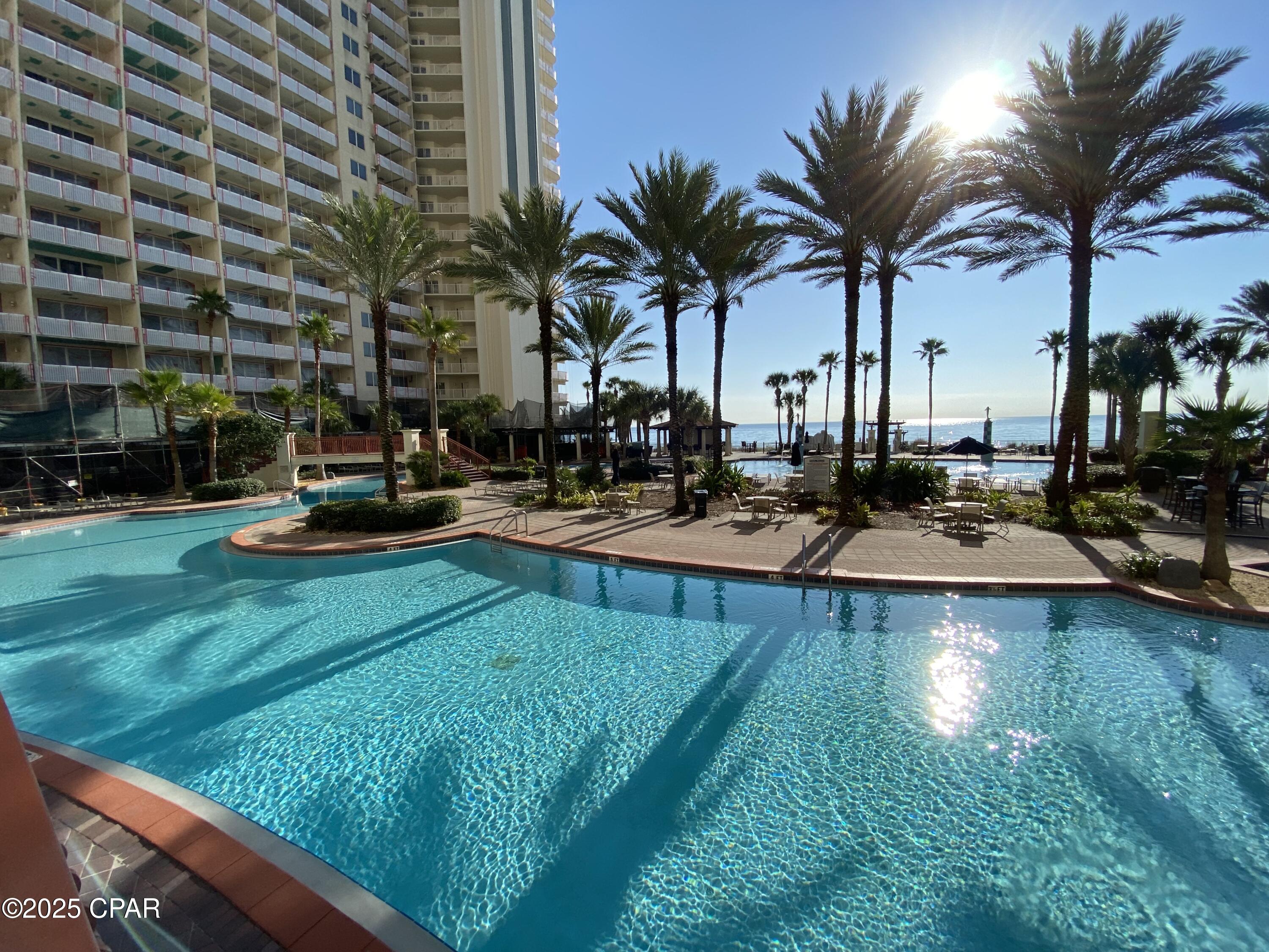 OWNER FINANCING AVAILABLE ASK FOR TERMS! The views from this 23rd floor condo are majestic! When you reach your front door, the eastern views pull you in. It's hard to go inside! Balcony views give you Westerly and South Gulf Views and fabulous views of the dynamic pool area. 
This Top Floor Penthouse unit sleeps 6 and has one full bedroom and bath, bunk room and bath, spacious living room/dining area and modern kitchen. Kitchen has granite countertops, stainless steel appliances, updated cabinets and is fully stocked for the upcoming rental season. Also comes Fully Furnished so turnkey ready to go! 
Lush Landscaping, Dolphin Fountains and pool space galore!  
Shores of Panama is a 23 story Tuscany style condominium. The complex offers amenities including around 500' feet of Gulf frontage, 14k square foot Gulf-side, zero entry gulf side pool, hot tub, heated indoor pool & hot tub, covered on-site parking garage, fitness center, two full-service bars serving lunch and dinner, beach events and rental services, high-speed internet access, and more!
Buyer and Buyers agent to verify all dimensions and anything deemed important.