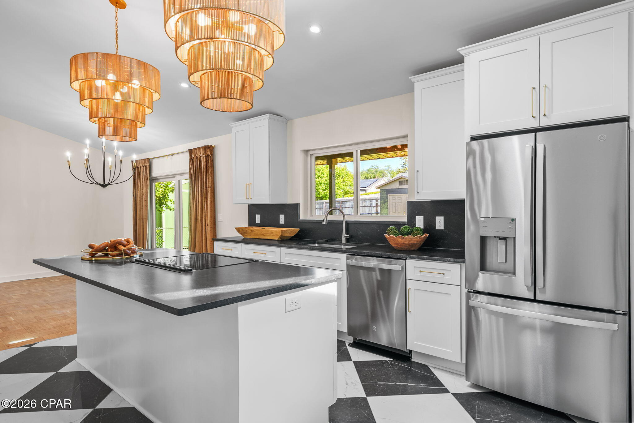 Welcome to 1809 DeWitt Street, where timeless Cove charm meets modern luxury. Perfectly positioned to capture stunning protected water views, this 4 bed 3 bath completely reimagined ranch-style home offers a rare opportunity to enjoy one of Panama City's most sought-after neighborhoods without compromise.

Every inch of this home has been thoughtfully renovated with an emphasis on quality craftsmanship, elegant finishes, and effortless everyday living. From the moment you arrive, you'll appreciate the attention to detail that transforms this property from simply updated to truly exceptional.

Inside, you'll find bright, inviting living spaces designed to maximize both comfort and style. The seamless blend of modern finishes and classic character creates a warm, welcoming atmosphere that feels instantly like home. Whether entertaining guests or enjoying a quiet evening overlooking the water, every space has been carefully curated to showcase the home's unique setting.

One of the property's most remarkable features is its protected water view--an increasingly rare amenity that provides a picturesque backdrop and a sense of tranquility that few homes can offer. Enjoy morning coffee as the sun rises over the water or unwind in the evening while taking in the peaceful scenery that makes this location so special.

Adding to the property's versatility is a detached climate-controlled storage building, offering endless possibilities as a workshop, hobby space, home office, fitness room, studio, or secure storage for valuable belongings. Having heated and cooled flex space separate from the main residence is a rare and highly desirable feature that enhances both functionality and value.

Located in the heart of The Cove, residents enjoy one of Panama City's most beloved neighborhoods, known for its mature trees, waterfront parks, golf-cart-friendly streets, and close proximity to downtown St. Andrews, marinas, dining, shopping, and entertainment. Opportunities to own a fully renovated home with enduring water views, flexible bonus space, and the unmatched lifestyle of The Cove are exceptionally rare.

This is more than a home--it's a lifestyle.