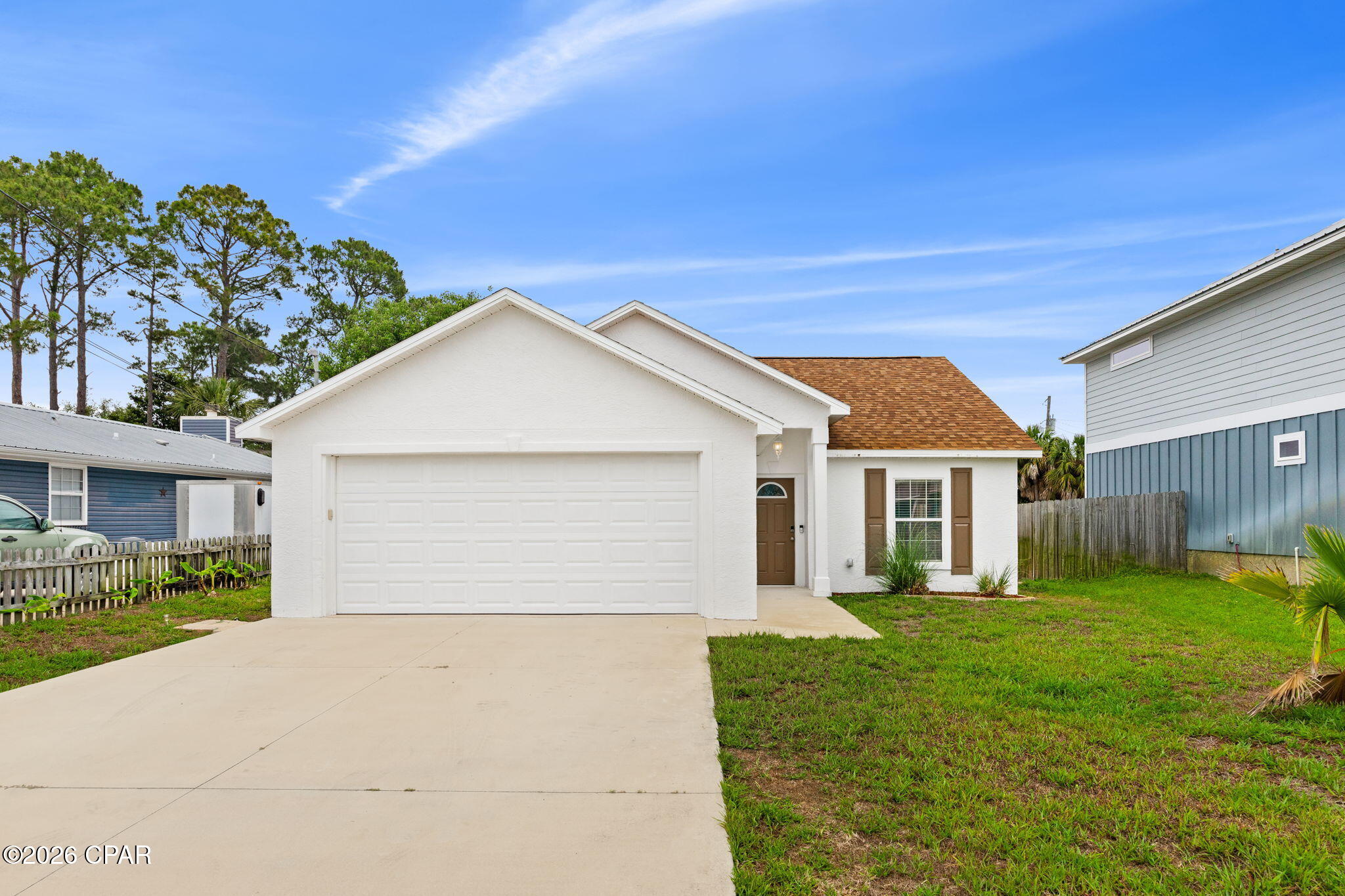 Welcome to this beautifully maintained 3-bedroom, 2-bath home in the heart of Panama City Beach! Conveniently located near the white sandy beaches, dining, shopping, and entertainment the area is known for, this home offers the perfect blend of comfort, functionality, and coastal living. Inside, you'll find a spacious and inviting layout designed for everyday living and entertaining alike. The kitchen flows seamlessly into the main living areas, creating an open and welcoming atmosphere. The primary suite offers a private retreat with an en-suite bath, while the additional bedrooms provide plenty of space for family, guests, or a home office.
Step outside to enjoy the covered patio overlooking the fully fenced backyard, perfect for relaxing evenings, pets, kids, or weekend gatherings. On a well for the Sprinklers. The 2-car garage provides ample storage and parking space, adding even more convenience to this well-rounded property. Whether you're looking for a primary residence, second home, or investment opportunity, this home's location near the beach and all that Panama City Beach has to offer makes it a must-see!