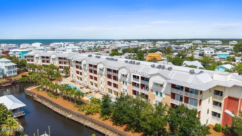 Welcome to Waterside Village Unit 410, one of the most desirable units in the entire complex, a top-floor 2BR/2BA condo with Gulf views that three out of four units here simply don't have. At 1,019 square feet, the open floor plan makes great use of the space, with the kitchen flowing naturally into the living and dining areas and featuring a breakfast bar, updated finishes, and recessed lighting throughout. The unit comes fully furnished and is move-in ready, with in-unit laundry, a walk-in closet, and elevator access, making day-to-day living as convenient as it gets. Step out onto your private balcony and take in the kind of Gulf views that are hard to come by at this price point in Mexico Beach. The building itself is HardiPlank construction on a slab with a metal roof, and the HOA covers insurance, internet, water, sewer, trash, and grounds maintenance, keeping ownership simple and low-maintenance. Waterside Village amenities include a community pool, BBQ area, boat dock, and canal access--perfect for fishing, boating, or just enjoying the waterfront lifestyle. Located right on Hwy 98 in the heart of Mexico Beach, you're a short walk or golf cart ride from the beach, dining, and everything the Forgotten Coast has to offer. Whether you're looking for a second home, full-time residence, or rental investment, this top-floor unit checks all the boxes. Call today!