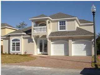 This beautiful four bedroom house is in a gated area of the The Glades. Features custom cabinets, tile throughout, hardwood floors on stairway and hall, mirrored closet doors. Master bath has garden tub, separate shower and double vanities. Screened pool can be accessed from master bedroom. Back of lot is wooded which provides privacy. Pool service and lawn care are included.